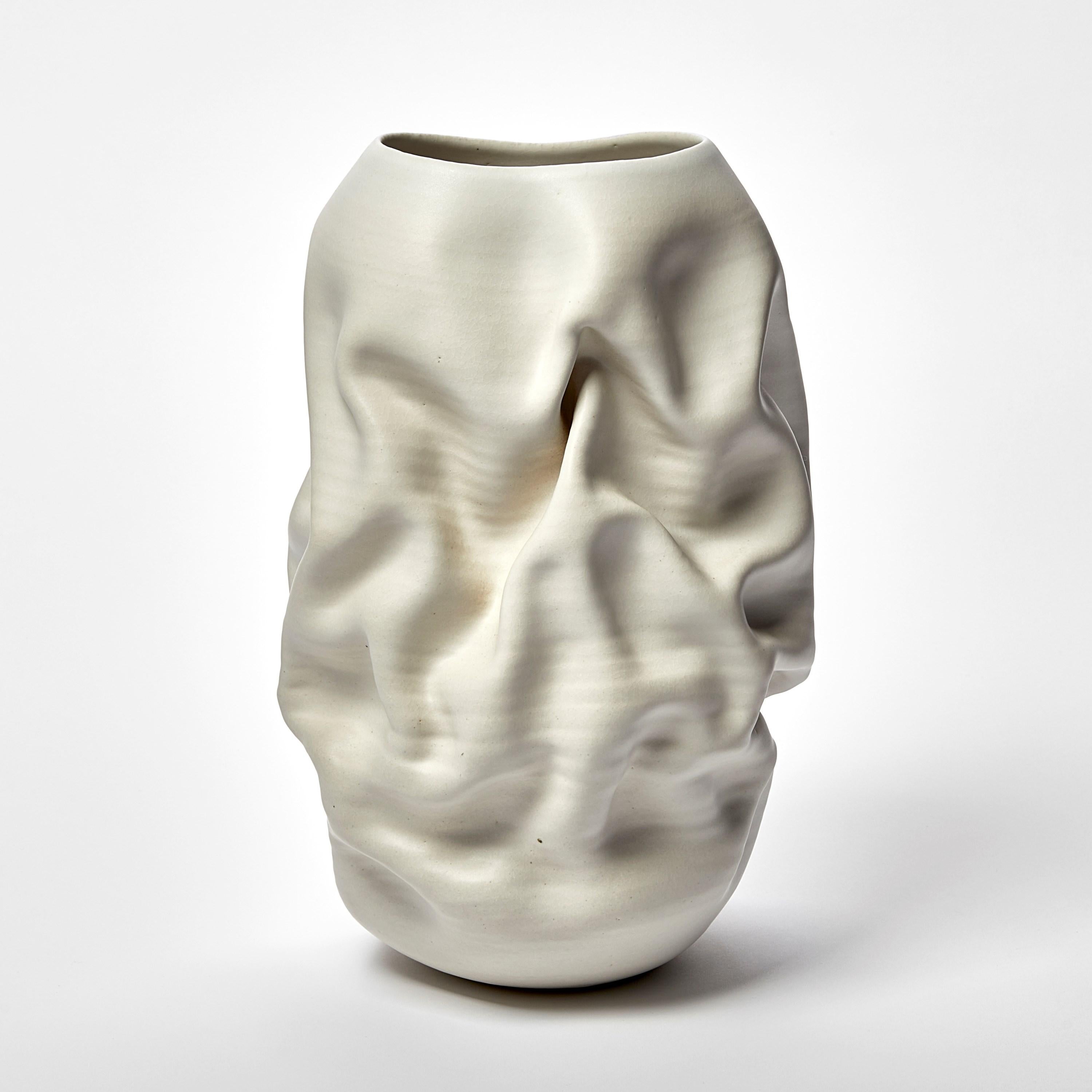 ‘Tall Crumpled Form No 118’ is a unique sculptural vessel by the British artist, Nicholas Arroyave-Portela.

Nicholas Arroyave-Portela’s professional ceramic practise began in 1994. After 20 years based in London, he moved and set up his studio in