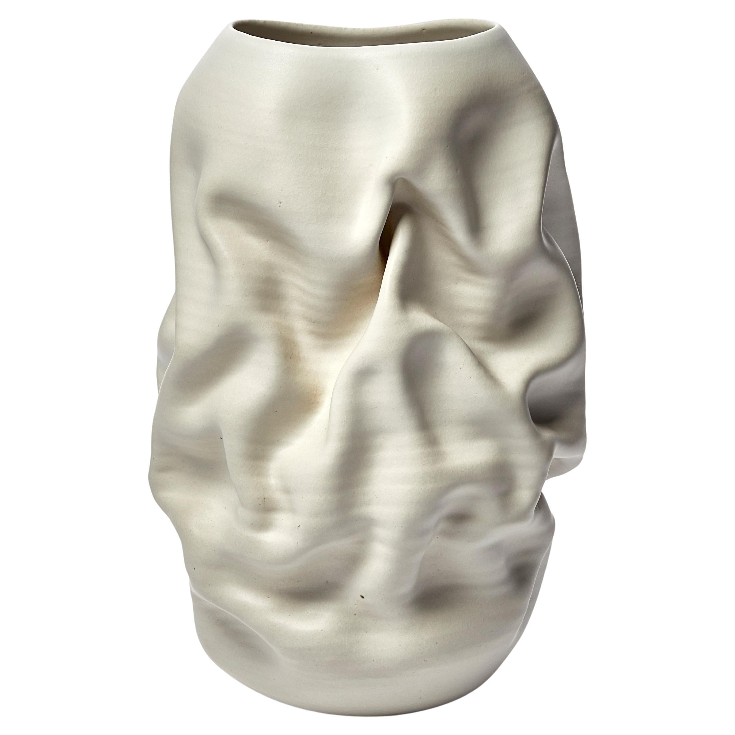 Tall Crumpled Form No 118, white ceramic vessel by Nicholas Arroyave-Portela