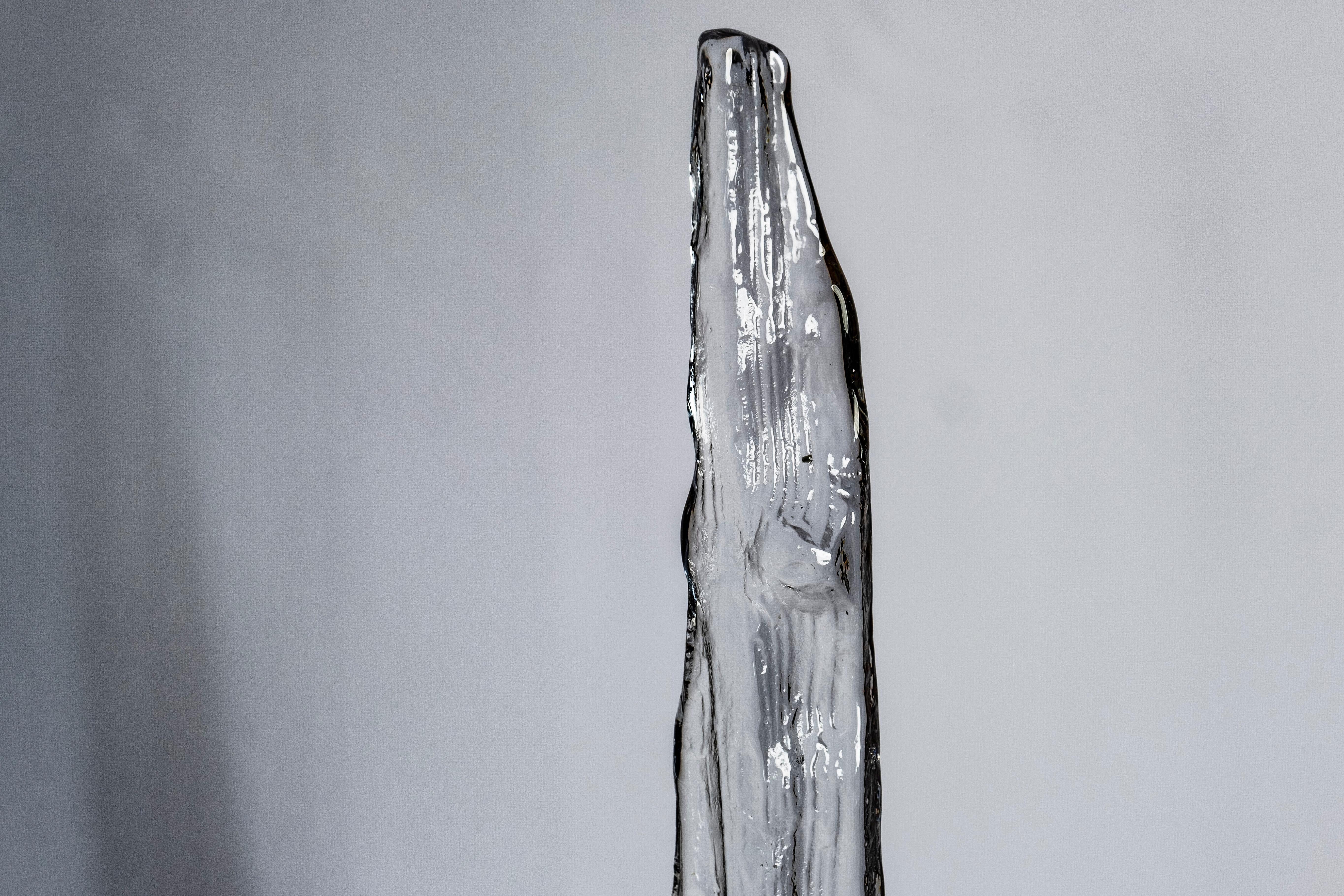 Tall Scandinavian Modern glass ice sculpture, of full lead crystal glass, designed by Bengt Edenfalk for Skruf. Reaches 55.5 cm tall incl. wooden base.