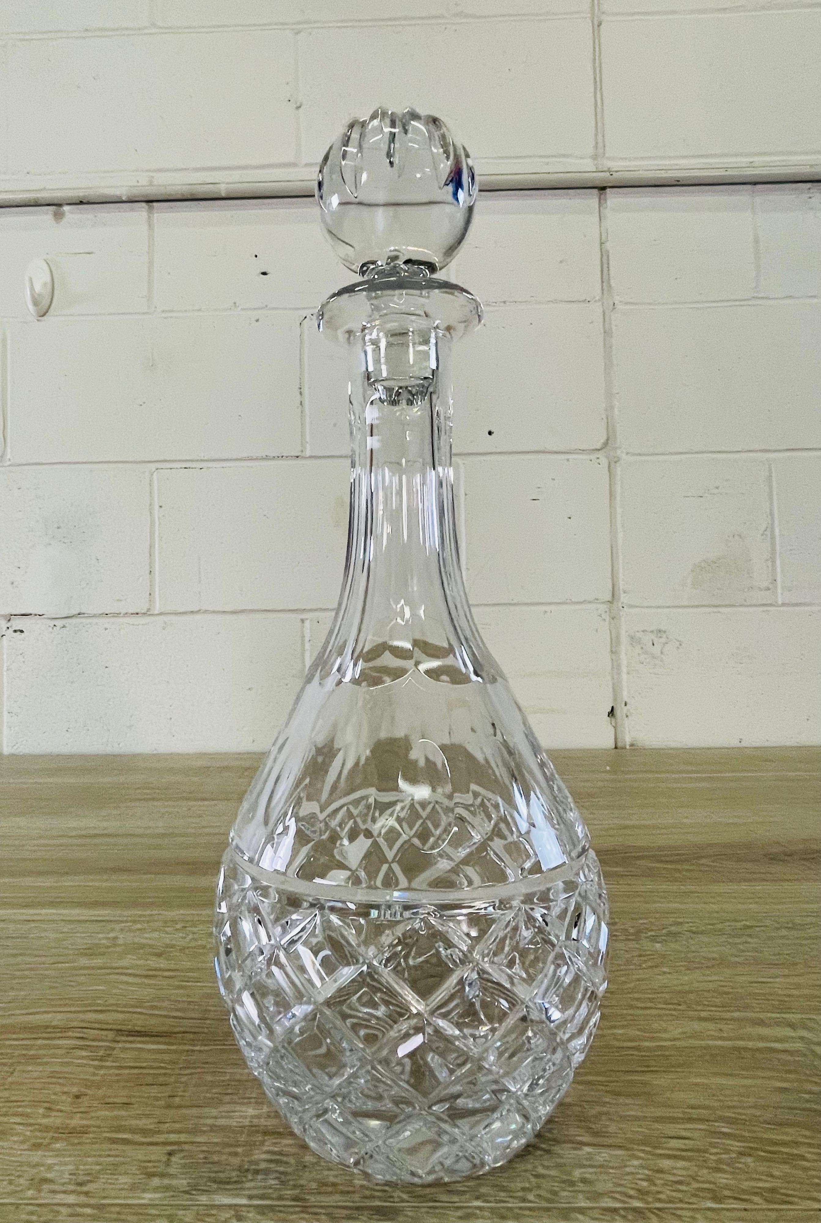 Vintage tall glass round crystal decanter with the stopper. Heavy glass decanter. No marks.