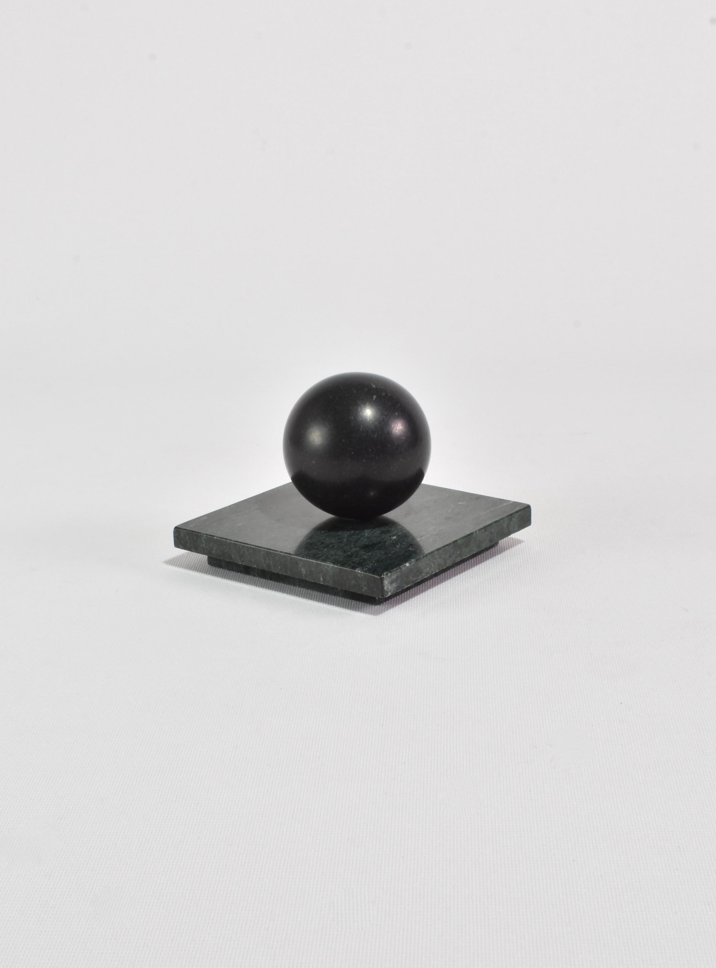 Tall Curio Box by Casa Shop in Green Marble with Black Onyx. Inspired by a favorite vintage find, each box features a polished rectangular base with a sphere handle. Handmade by artisans in India.

Use it to hide away an array of cherished items – a