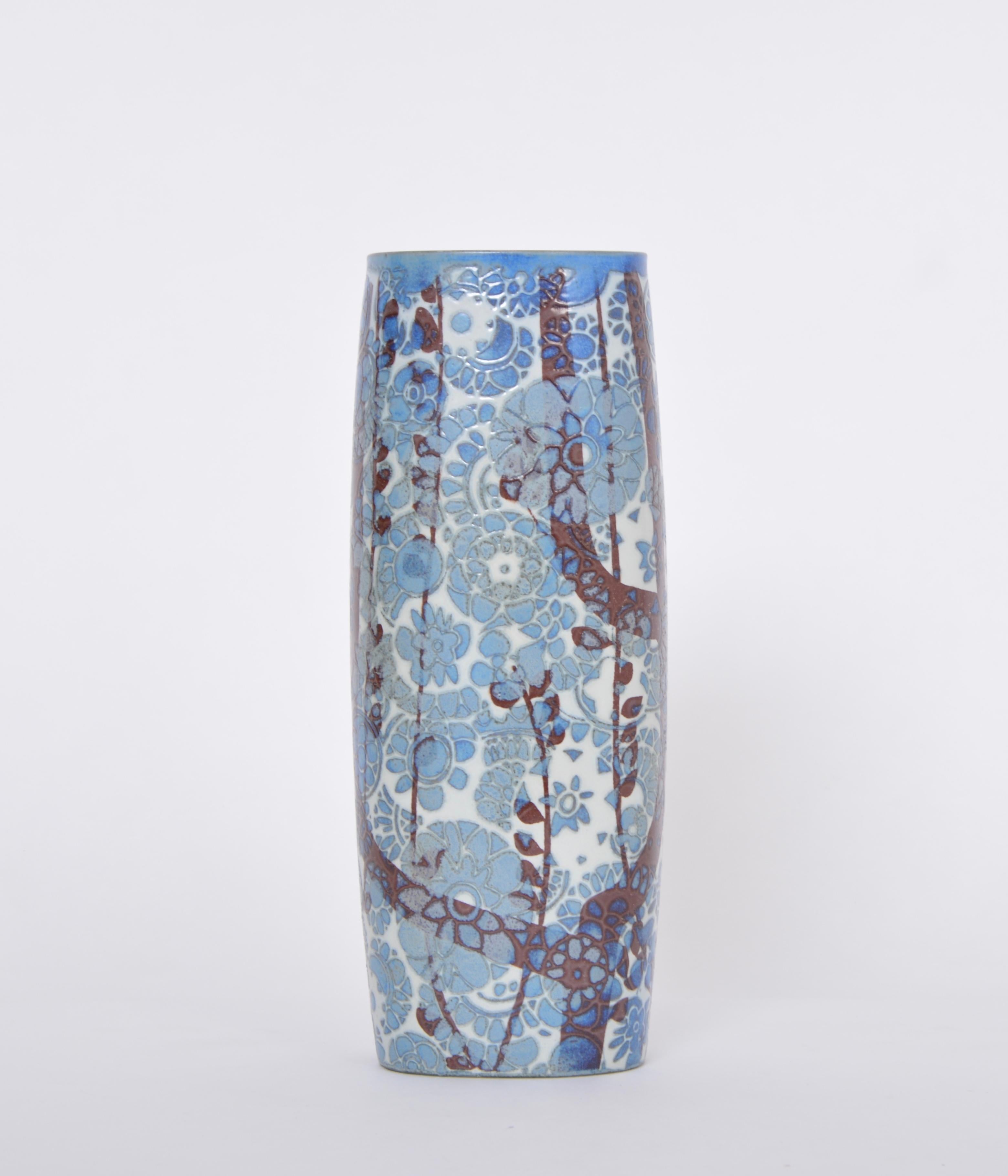 Tall Danish midcentury BACA Vase by Johanne Gerber for Royal Copenhagen 
This vase's decor was designed by Johanne Gerber for Royal Copenhagen. It features a beautiful pattern made of flowers and branches in blue and black. 
The vase is in very