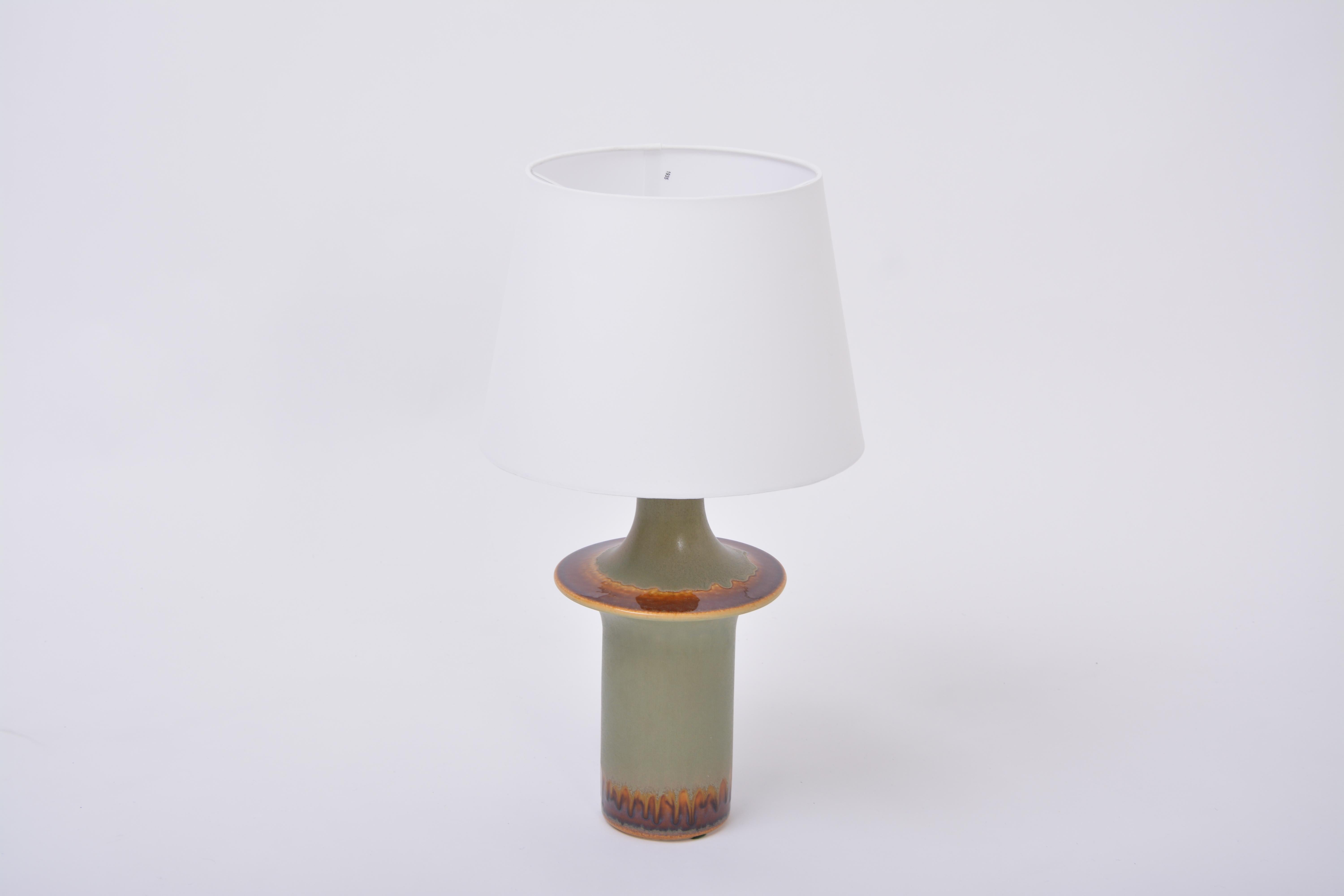 Tall Danish Mid-Century Modern ceramic table lamp by Soholm

Table lamp made of stoneware with ceramic glazing in beautiful tones of bronw and green produced by Soholm Stentoj in Denmark in the 1960s. Measurements of the base are heigt 40 cm and