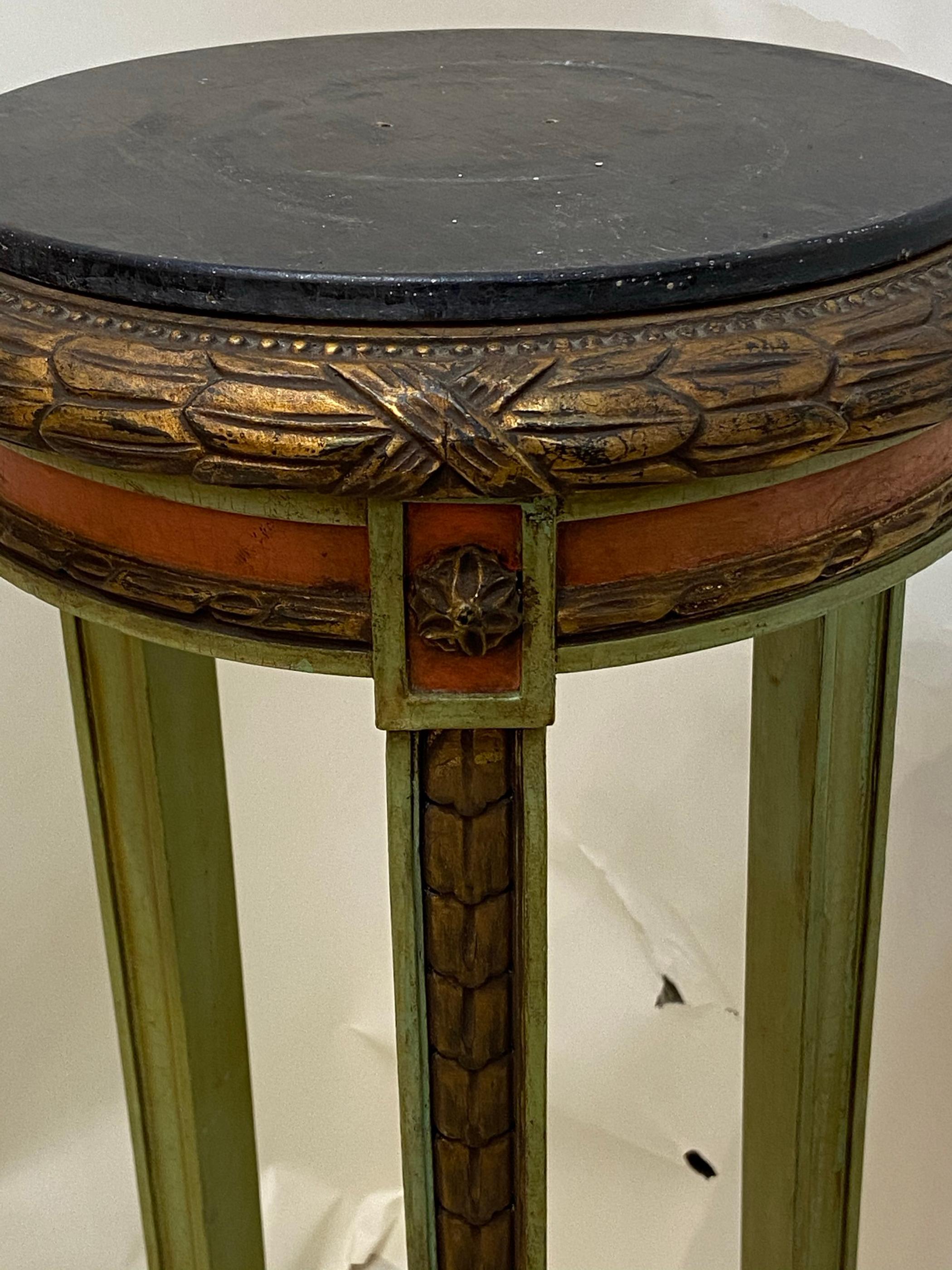 Nice old paint on these polychrome stands could be used for either plant stands or display stands. Painted black wooden tops. Decorative gilding on edges Very useful and attractive stands. Nice old paint on these polychrome stands could be used for