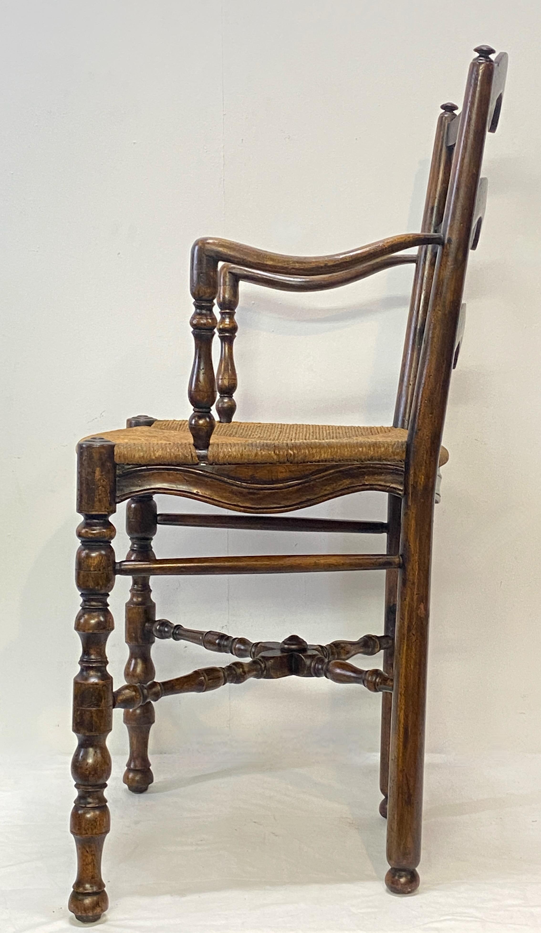 Carved Tall Early 19th Century French Provincial Walnut Armchair For Sale