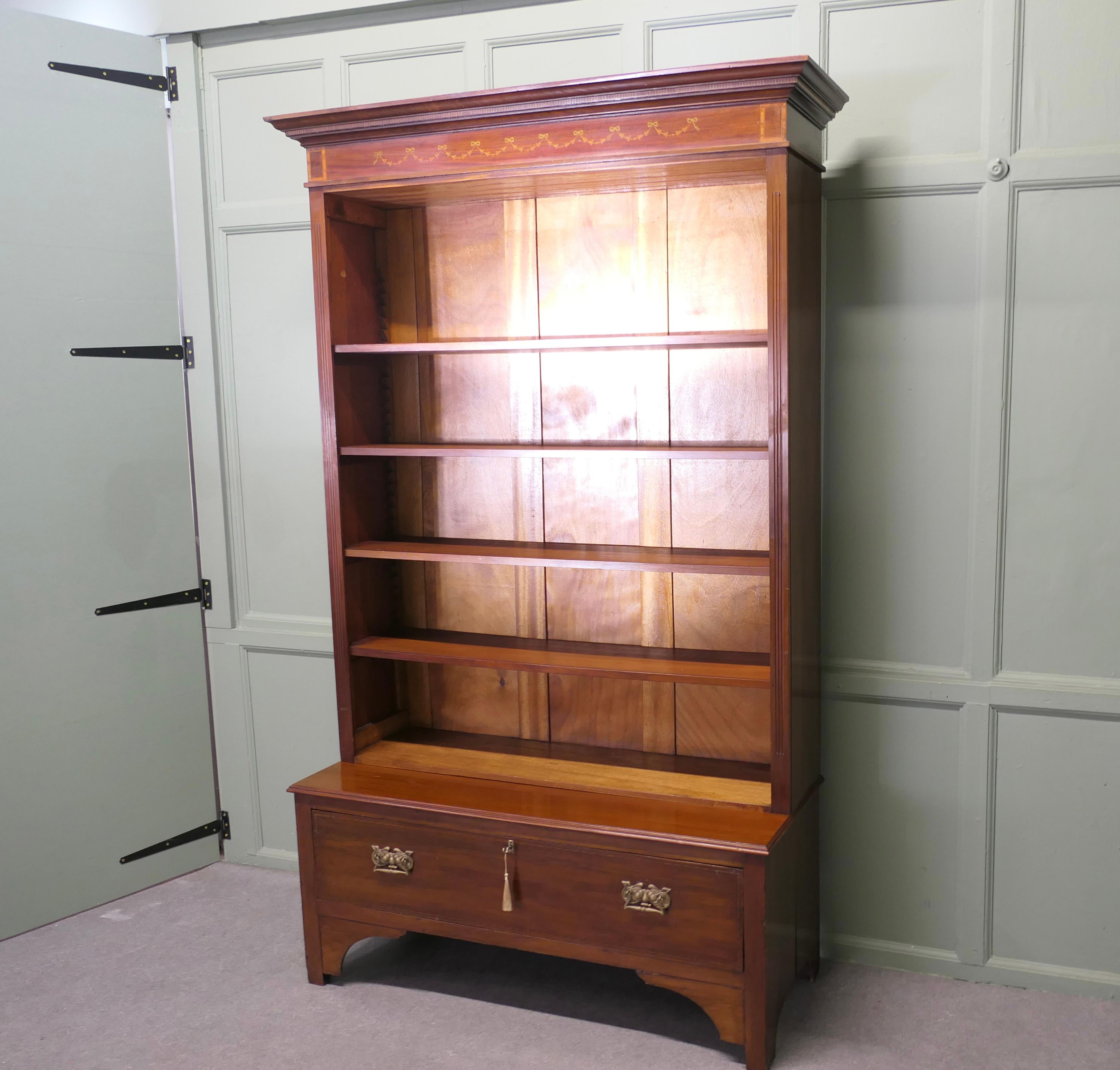 Tall Edwardian Walnut Bookcase
This great piece comes into 2, the top part is an open fronted bookcase with adjustable shelves and it has an elegant outward sweeping cornice to top it off
The lower base of the Cupboard has a large long drawer and it