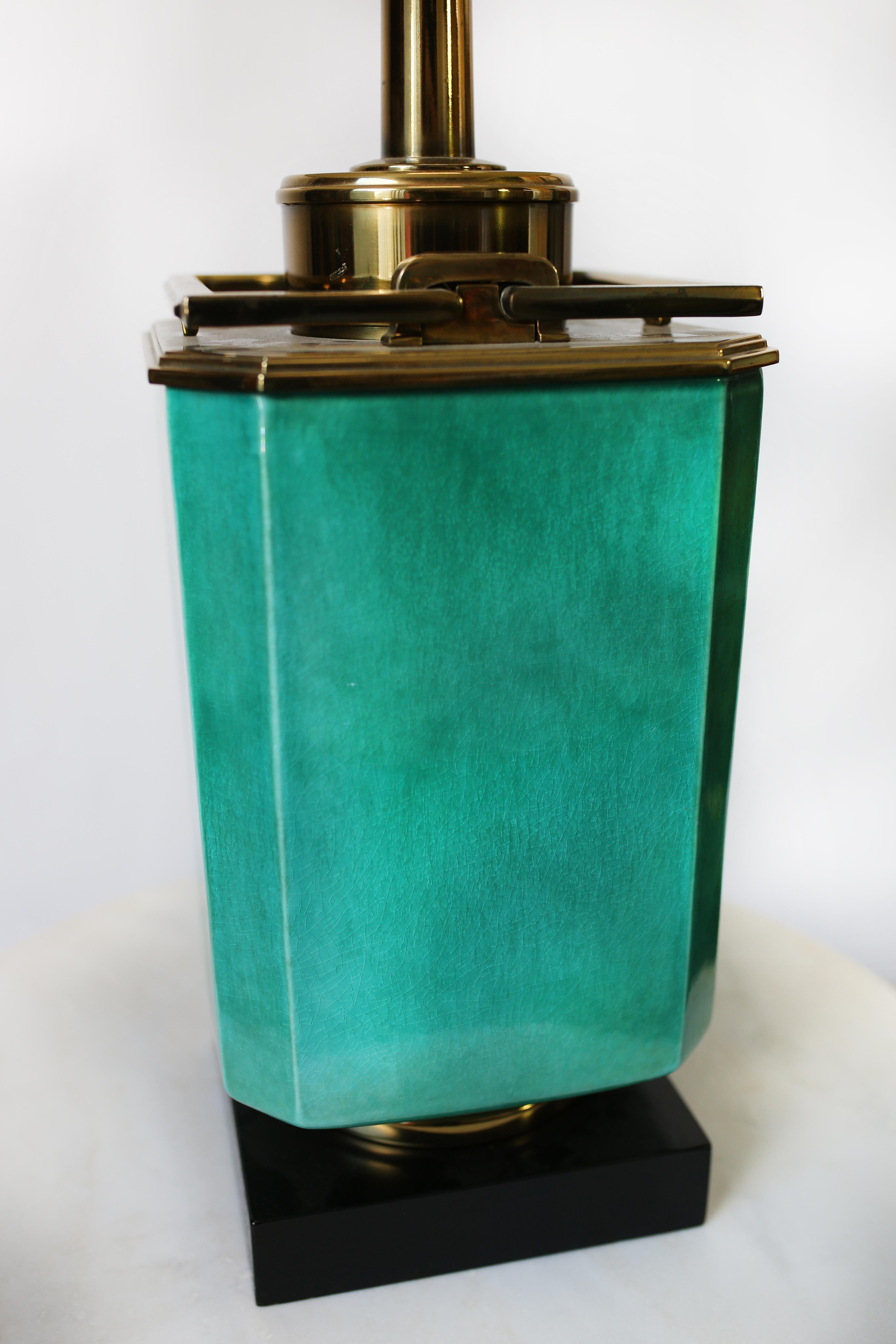 This turquoise and brass table lamp by Edwin Cole for Stiffel is in overall very good condition. Wear consistent with age and use. Beautiful aged brass hardware. Lamp shade included,
circa 1950s, USA.
Dimensions without the shade: D 9.5