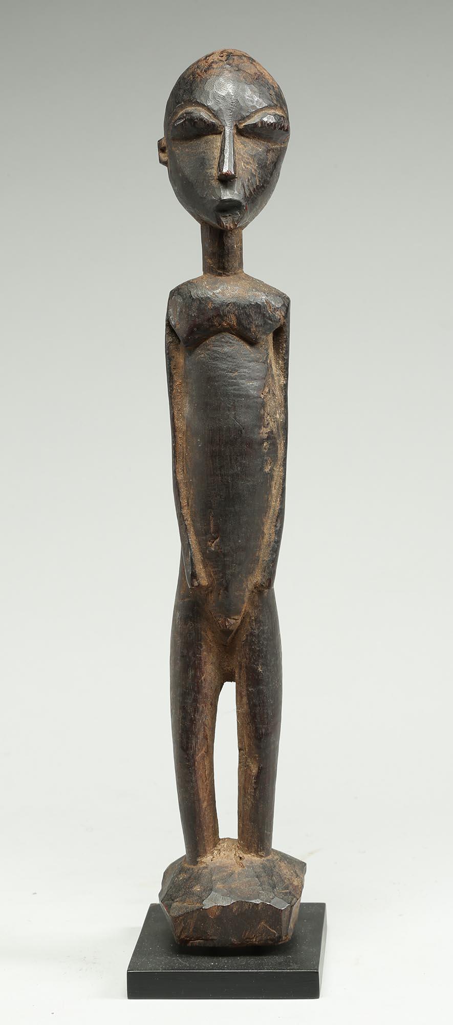 Tall elegant standing Lobi figure with expressive face, simple features, old worn dark patina. Early 20th century Ghana. 14 1/4 inches on custom base. Check all the angles! Long elegant, tapered eyes. Old hole on back of head, probably from opening
