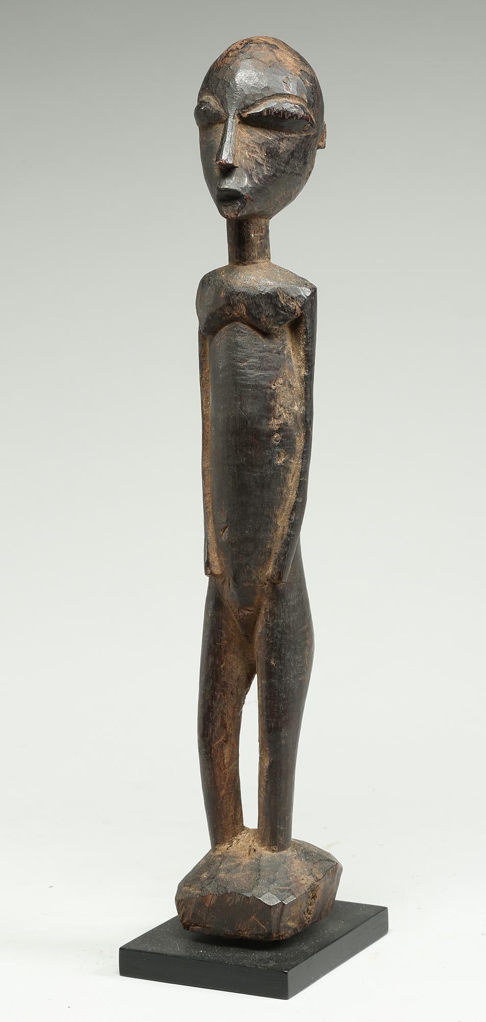 Ghanaian Tall Elegant Standing Lobi Figure with Expressive Face, Early 20th Century Ghana