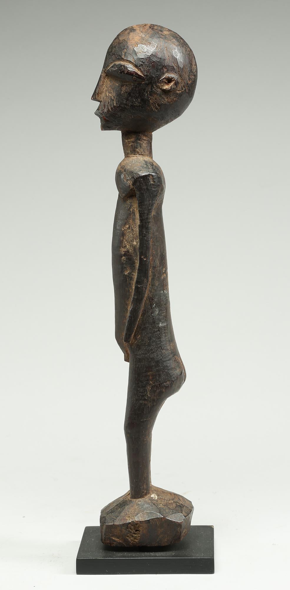 Hand-Carved Tall Elegant Standing Lobi Figure with Expressive Face, Early 20th Century Ghana