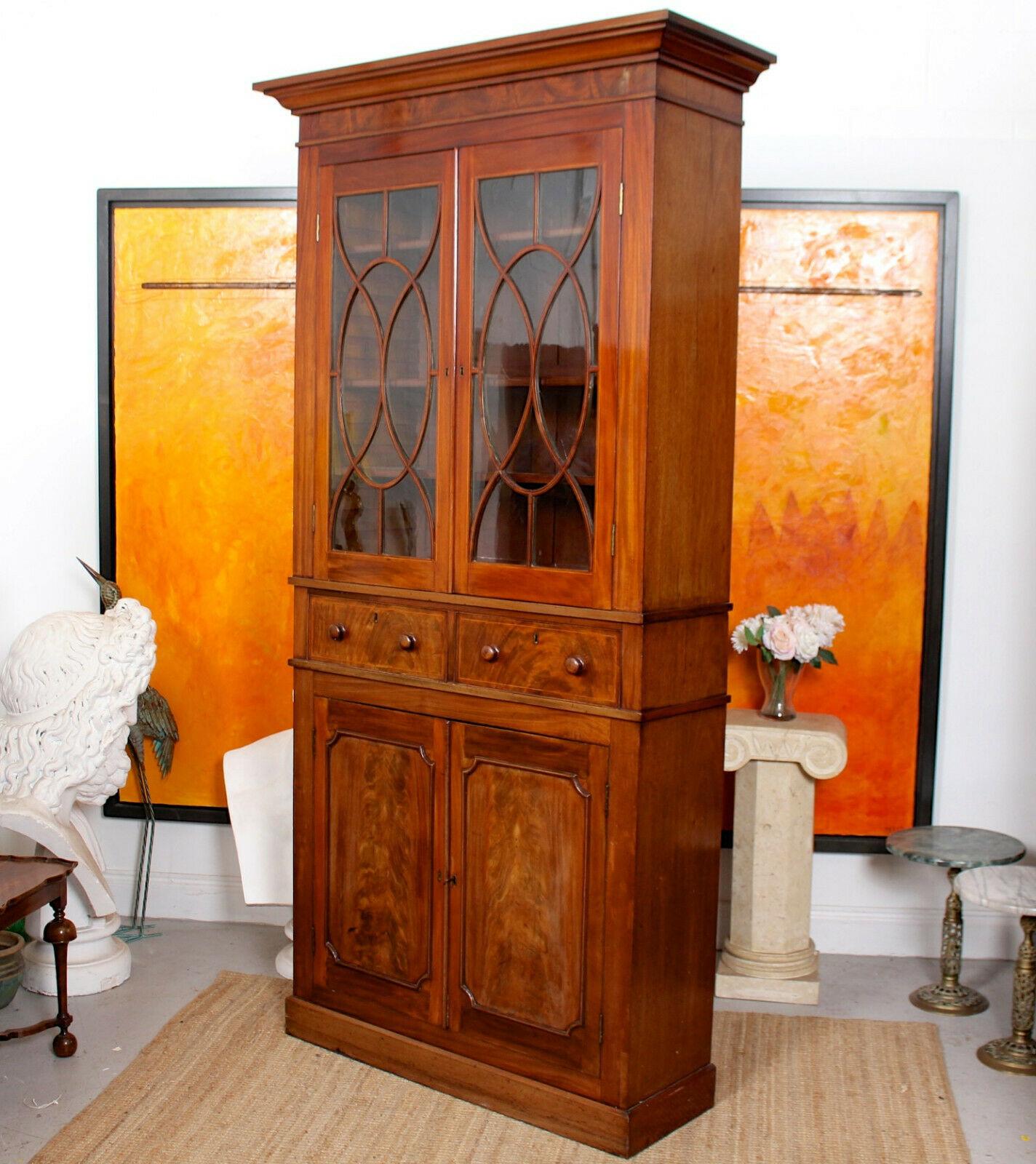 A fine quality 19th century glazed bookcase.

The mahogany boasting a well figured grain and rich polished patina.

The upper section with a projecting cornice above astragal glazed doors enclosed adjustable shelving. The lower section fitted a