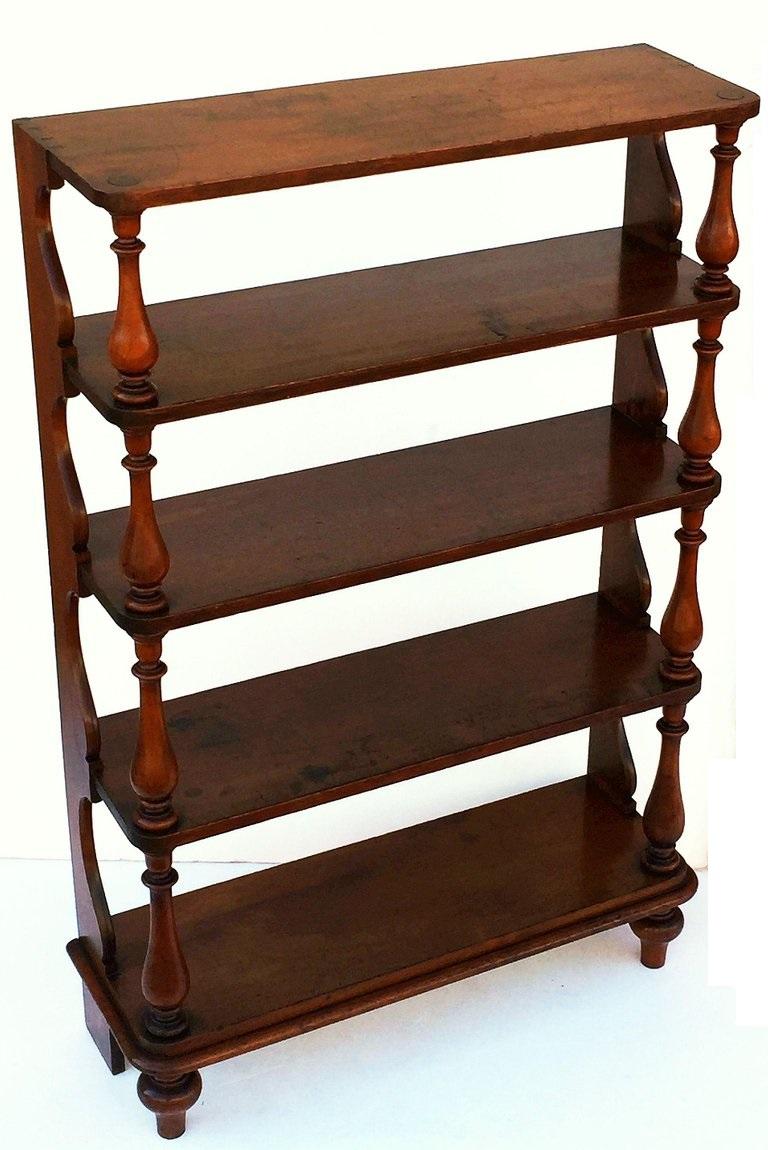 A fine tall English etagère or standing shelves or shelving unit of fruitwood, featuring five large shelves with carved baluster column front and ogee back.

Makes a great bookcase or curio cabinet!