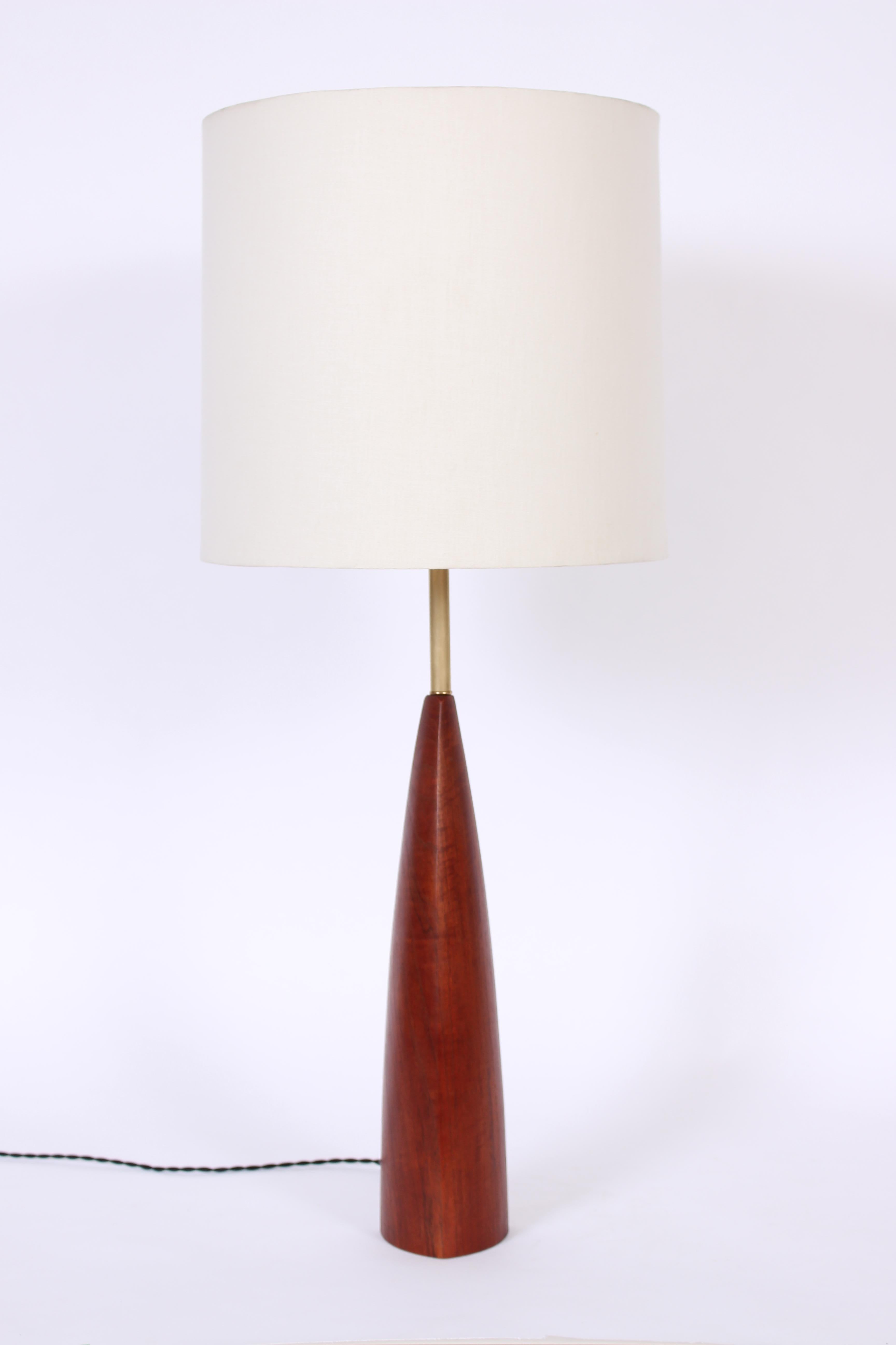 Danish Mid Century Ernst Henriksen Teak and Brass Table Lamp. With Brass shaft and weighted cast iron base. Standard socket. Small footprint. 26H to top of socket. Teak 17H. Shade shown for display only (13H x 13D top x 14D bottom). Timeless. Danish