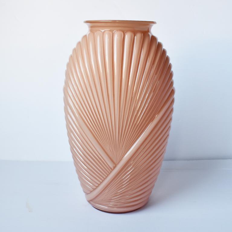 Tall pink 1980’s style glass and ceramic vase in a pink blush color with wonderful proportions. The body of this vase is oval in shape, with a small round base which widens through the middle, and tapers at the top. The body is decorated with an