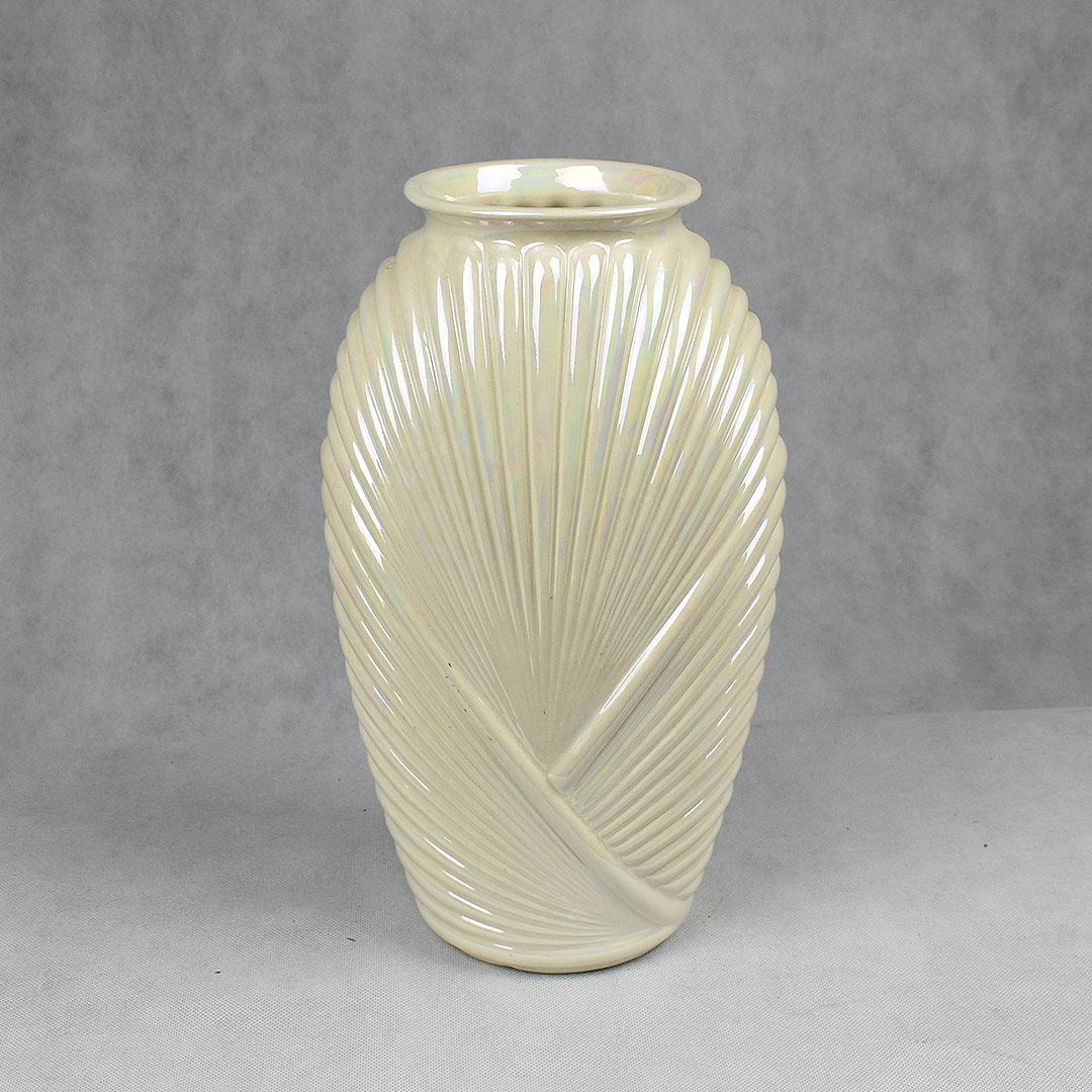 Tall pearlized white 1990s style glass and ceramic vase in a light white pearlized finish and wonderful proportions. The body of this vase is oval in shape, with a small round base which widens through the middle, and tapers at the top. The body is