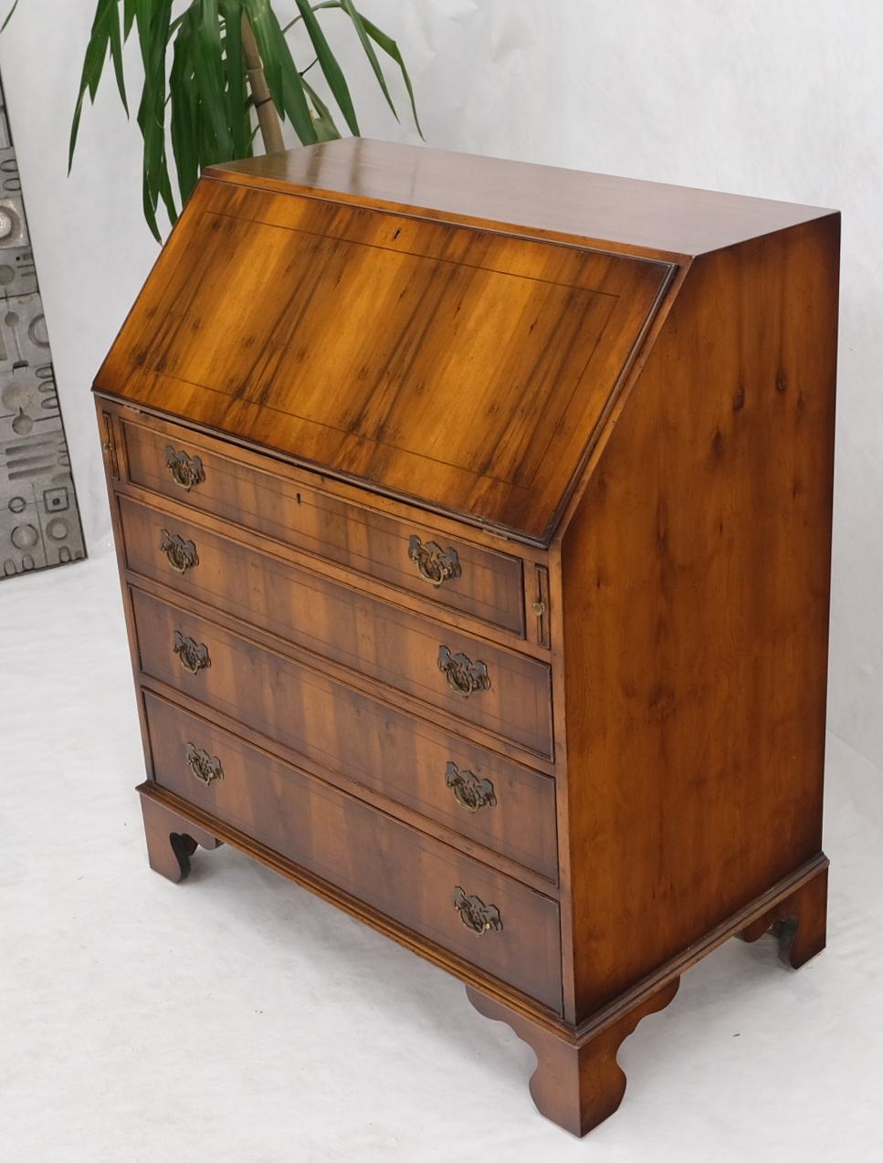 Tall Federal Style drop front secretary individual pains glass door bookcase. Stunning exotic wood pattern. Four storage drawers.