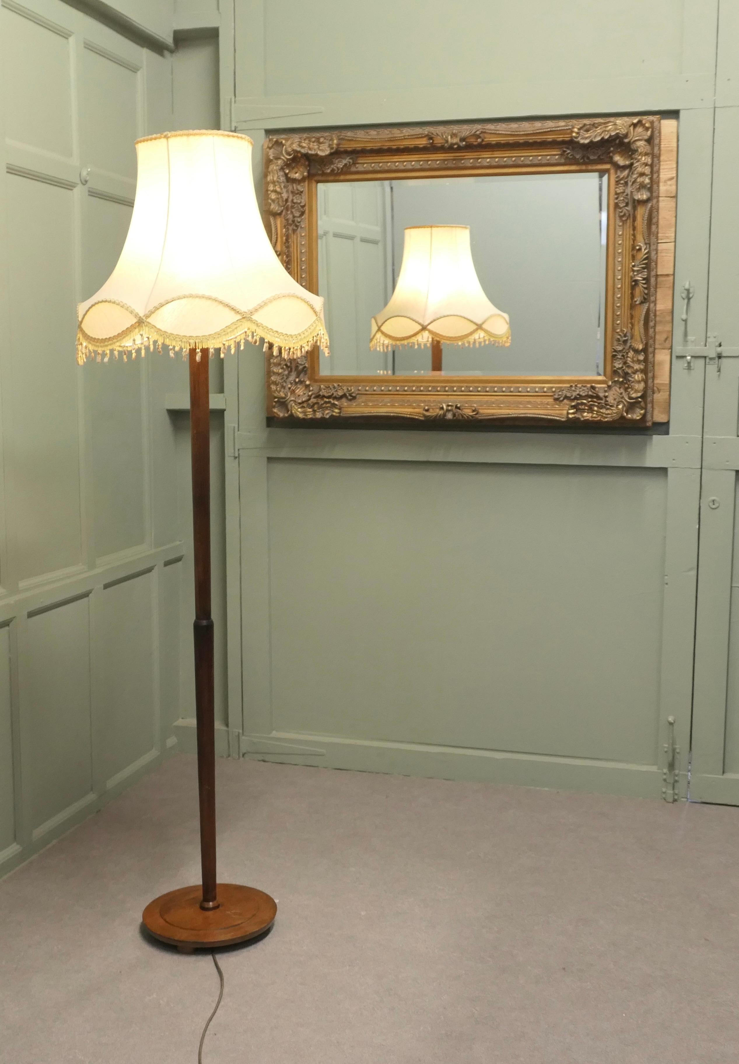 Tall Floor Lamp, Standard Lamp

The central column stands on a turned chunky wooden base, the lamp is in good condition, the wiring is good, this is a very fine quality lamp and comes with its original lampshade
The lamp is 73” high, the base is 13”