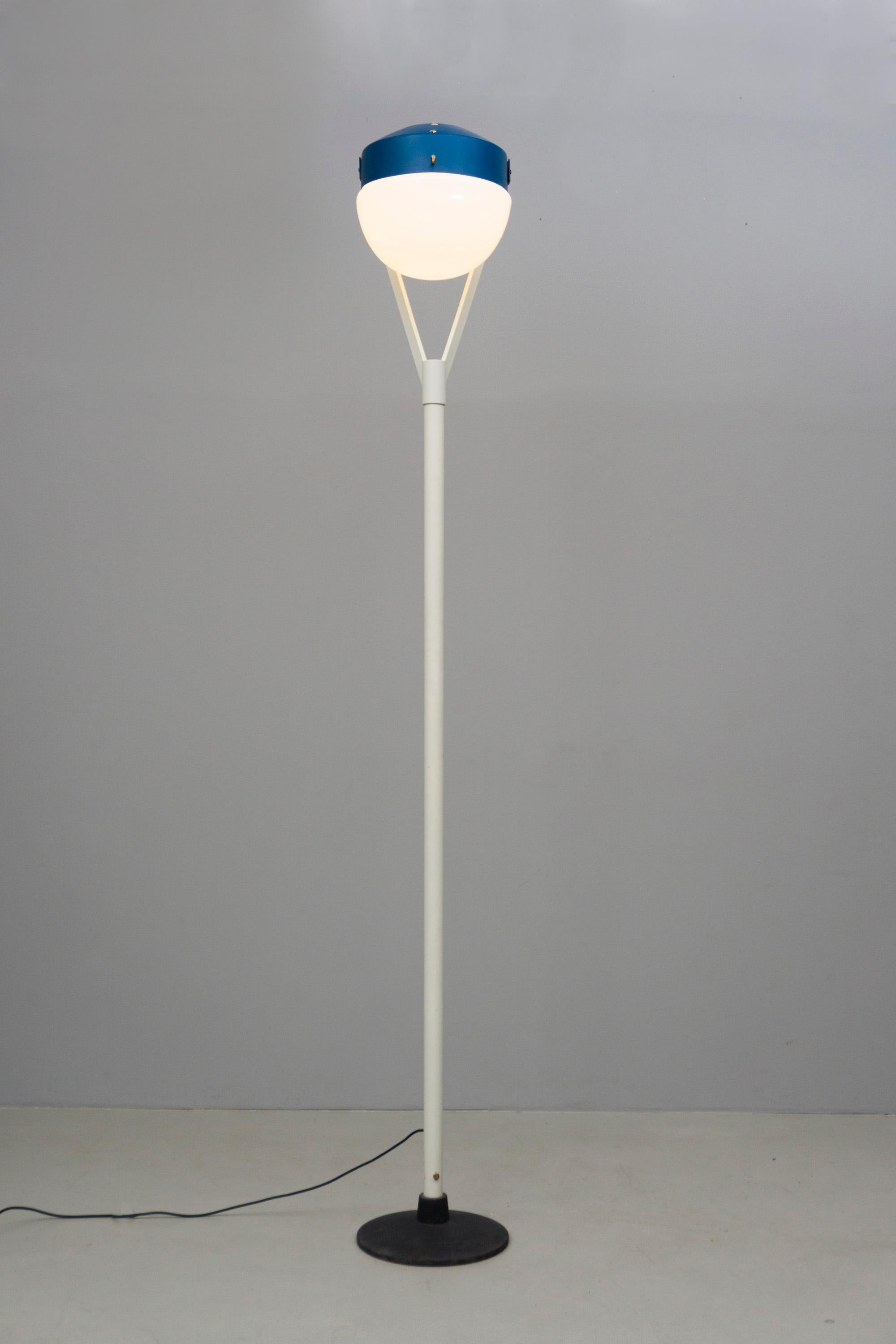 Eccentric floor lamp by Bruno Gatta, made of metal, lacquered in blue and white, blue reflector and white round opaline glass. Labeled Stilnovo.

Two pieces available, price is for one.

Bruno Gatta (1904) was born in to a family of Industrial