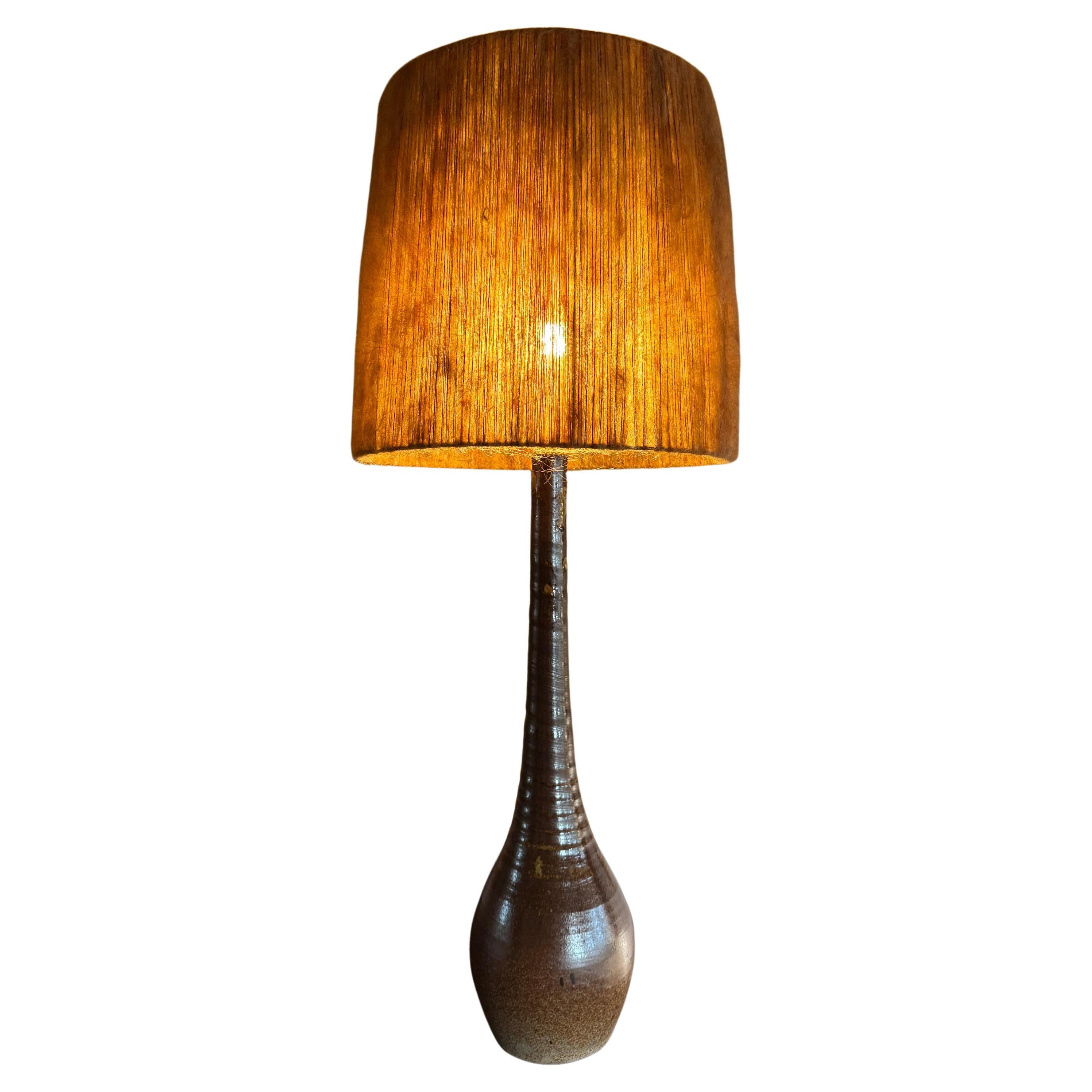 Tall French 1950’s glazed pottery lamp with fabric shade