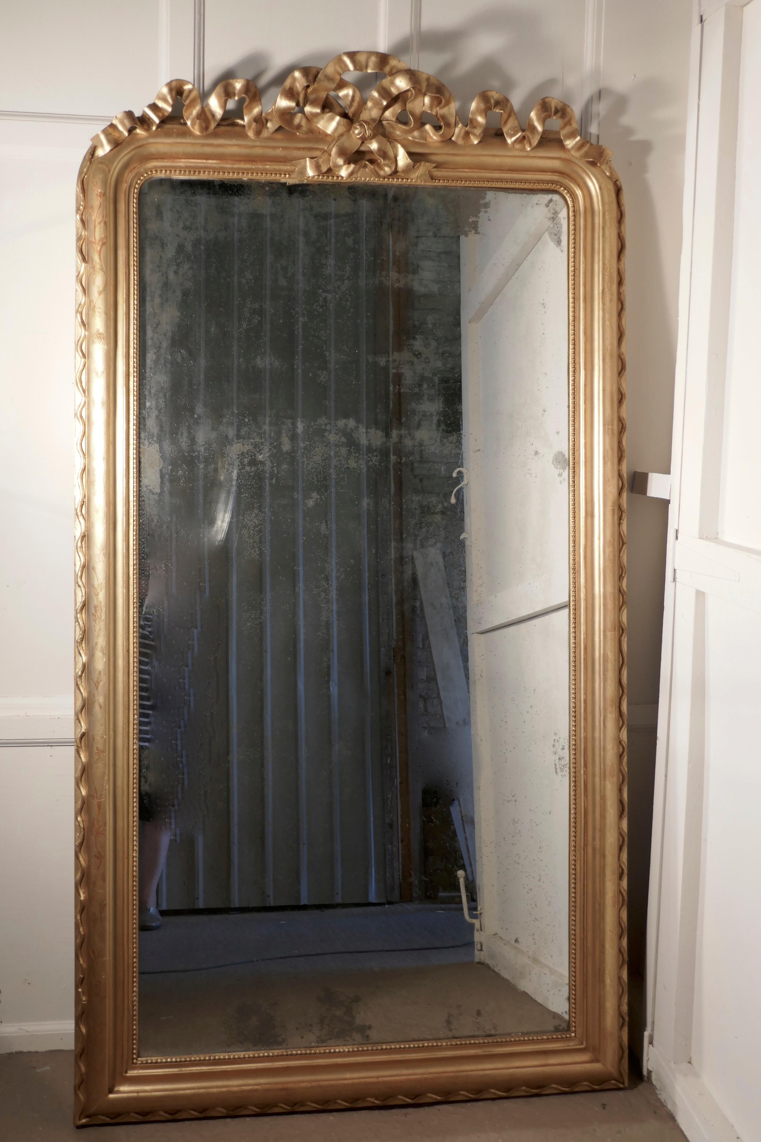 French 19th century decorated Louis Philippe wall mirror, 7ft tall
 
This is a magnificent large statement piece and genuine 19th century French chic furnishing, the 5” gold frame has a charming slightly shabby finish, it is decorated with a rope