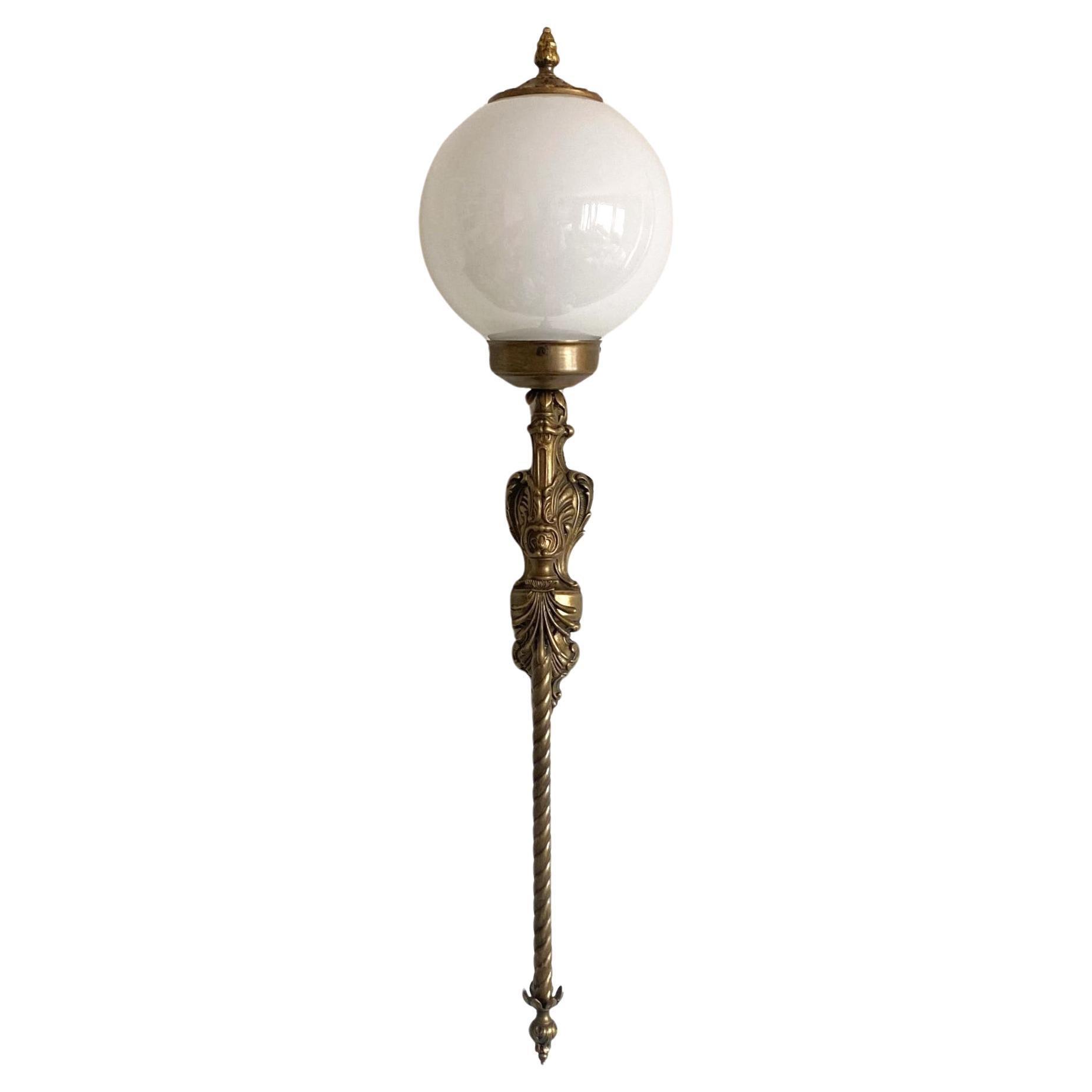 Superb, tall bronze wall torchiere sconce or wall lantern for indoor and outdoor use, France, 1920-1929. Old Bronze richly decorated with fine details, hand-blown opaline glass ball globe. It takes one E27 screw light bulb. LED bulbs can also be