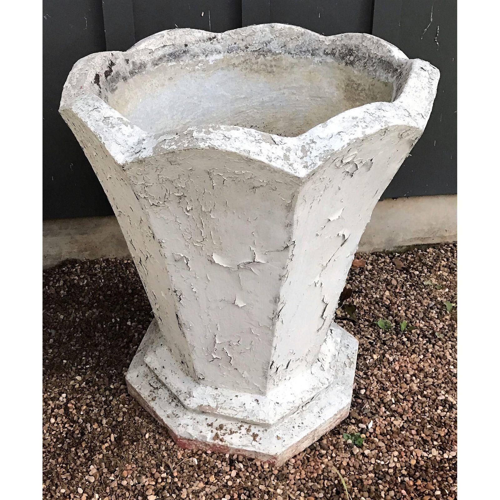 Heavy and tall French concrete planter in the Art Deco style. Painted white with scalloped top and octagonal base. At some time was painted. Pleasing, interesting shape. 