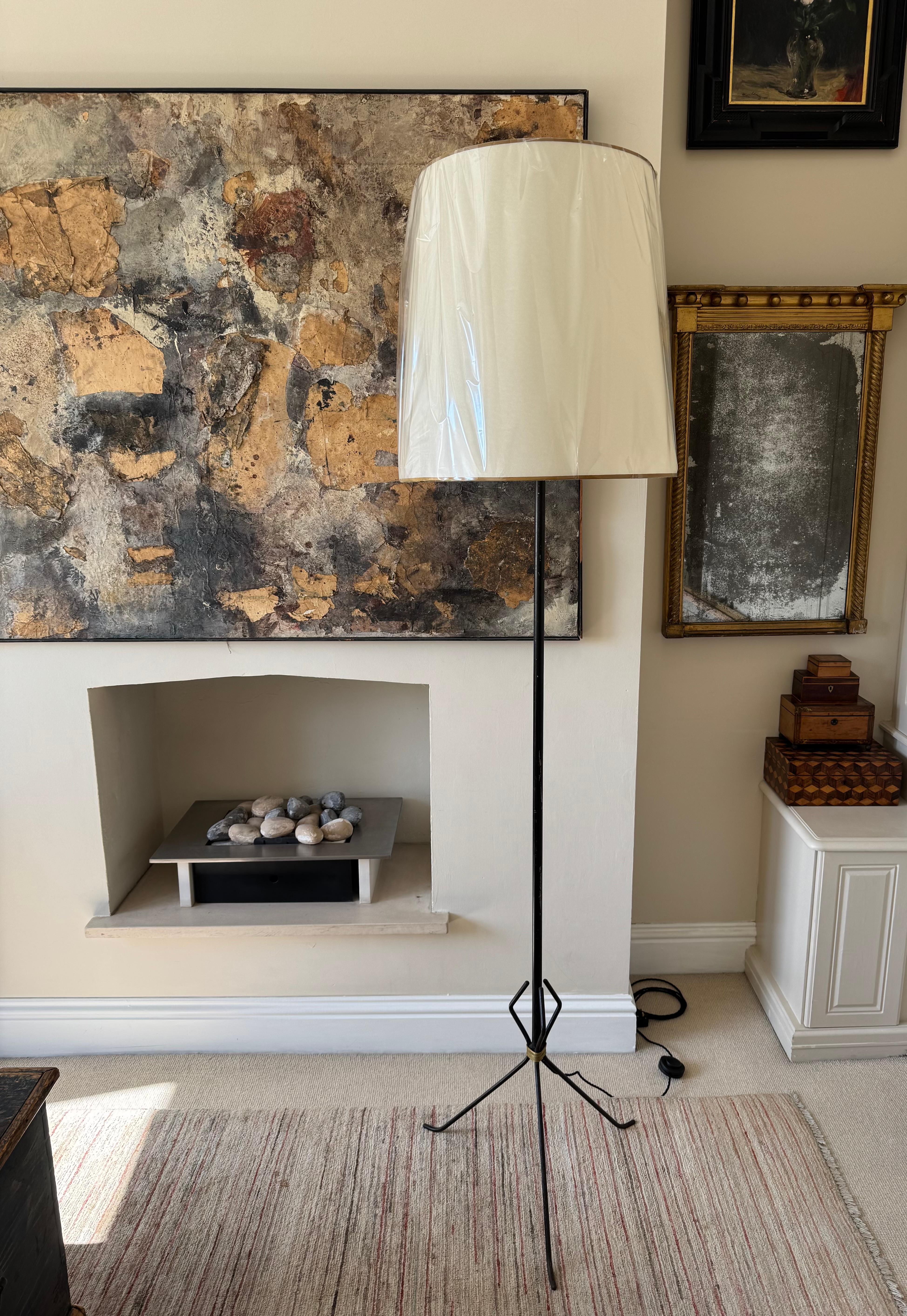 A tall elegant black metal tripod based floor lamp with gilt metal rope detail. Rewired witg black silk flex and floor switch. Shade for display.
Measurements to top of shade: 200cm
Dia shade: 52cm