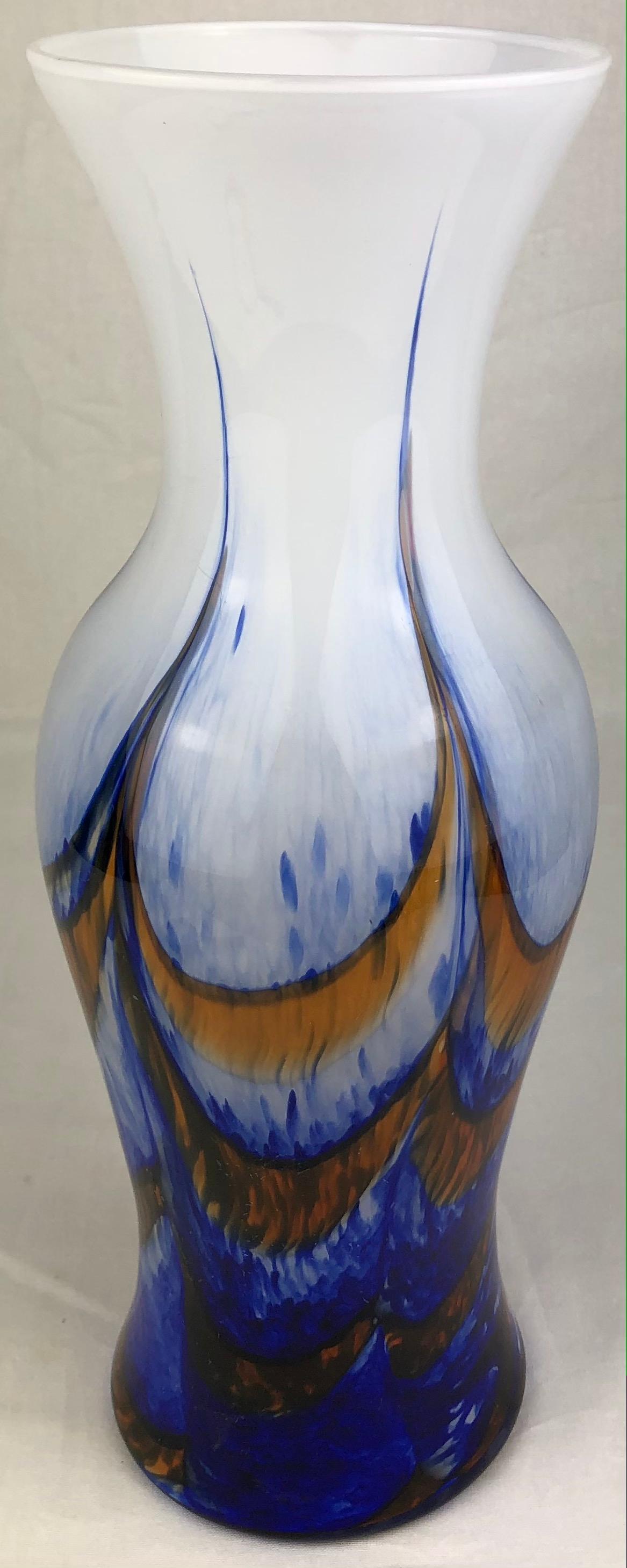 A white, blue and orange variegated tall art glass vase perfect as a center piece on a dining or side table. French Art Deco transition period, attributed to Schneider Glassworks. White background with beautiful blue and orange swirl motifs.