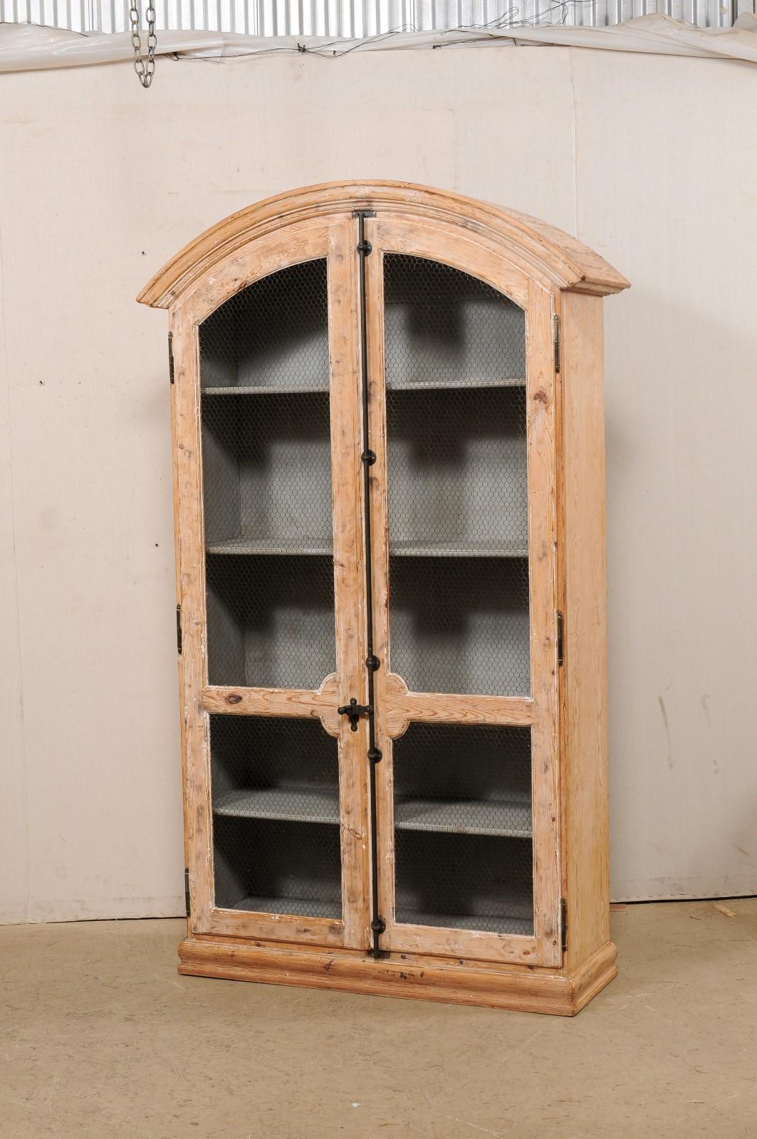 tall arched cabinet