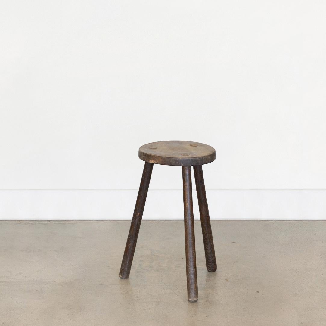 Vintage tall wood stool with circular seat and tripod legs from France. Original wood finish with great age markings and patina. Can be used as a stool or as side table.



 