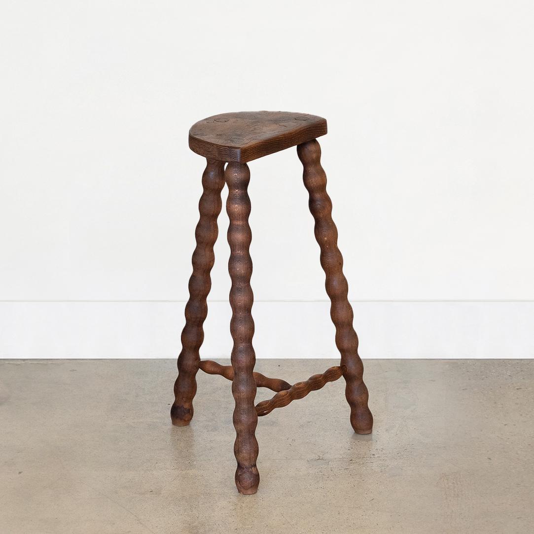 Tall vintage wood stool with semi-circle seat and beautiful wavy legs from France. Original wood finish with great age markings and patina. Perfect as a side table next to a chair or bathtub. 