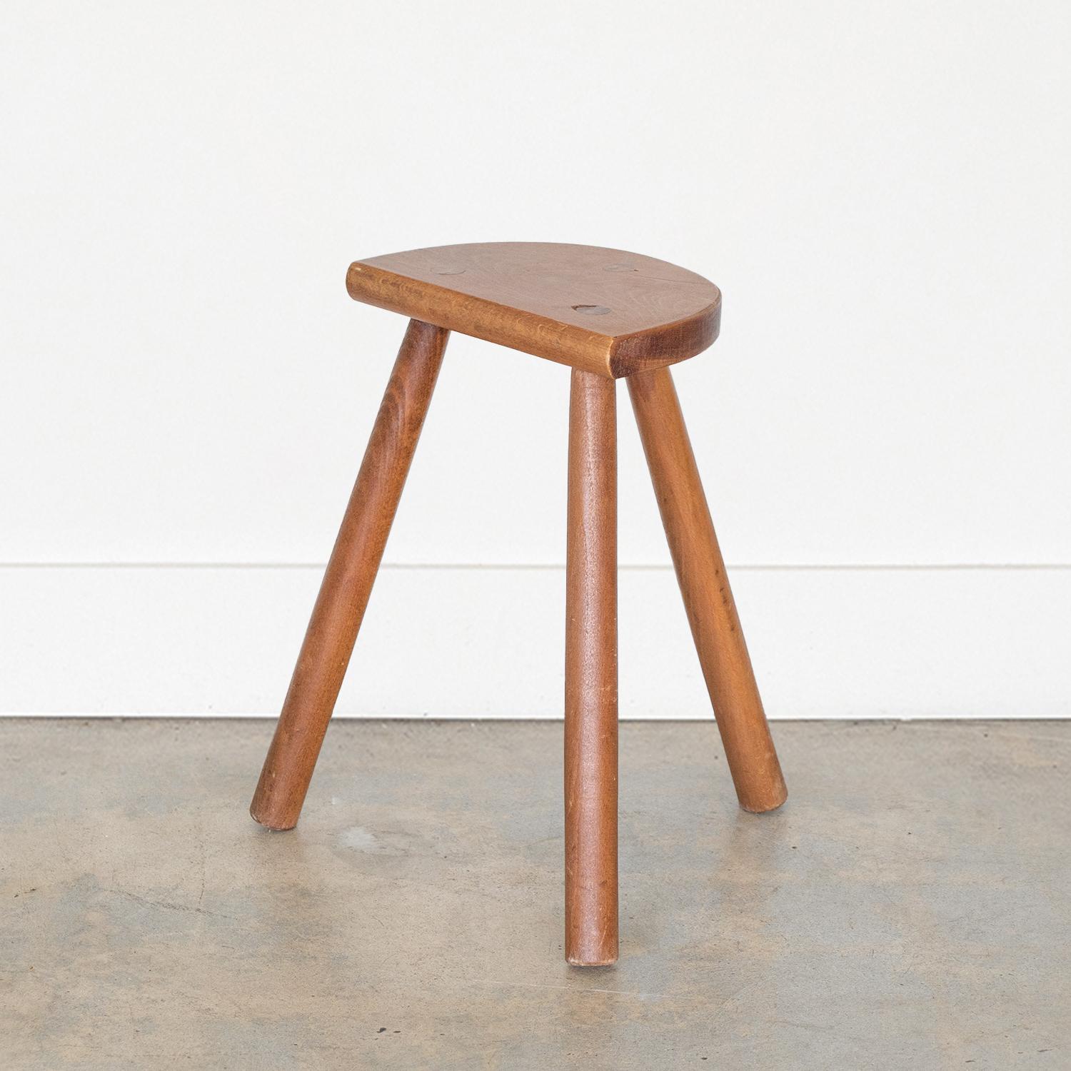 Vintage tall stool with semi-circle seat and tripod legs from France. Original finish with great age markings and patina. Can be used as a stool or as side table next to chairs.

