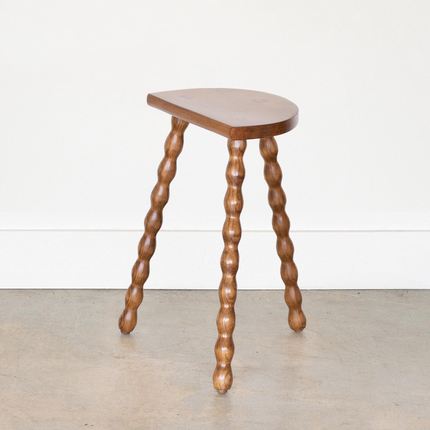 Vintage tall wood stool with semi-circle seat and wavy tripod legs from France. Newly refinished. Can be used as a stool or as side table. 



