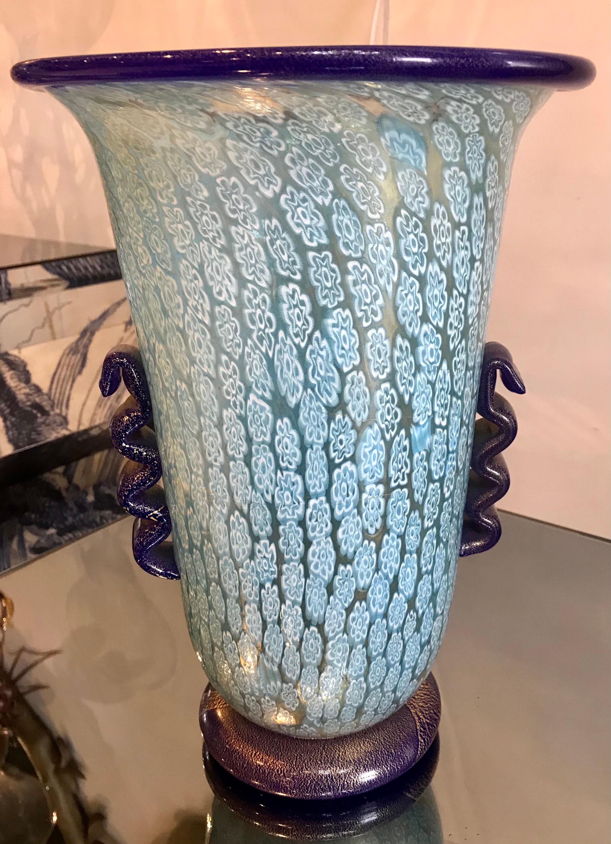 Tall light blue Millefiori vase. The cobalt blue base and handles have gold inclusion. In extremely good condition.