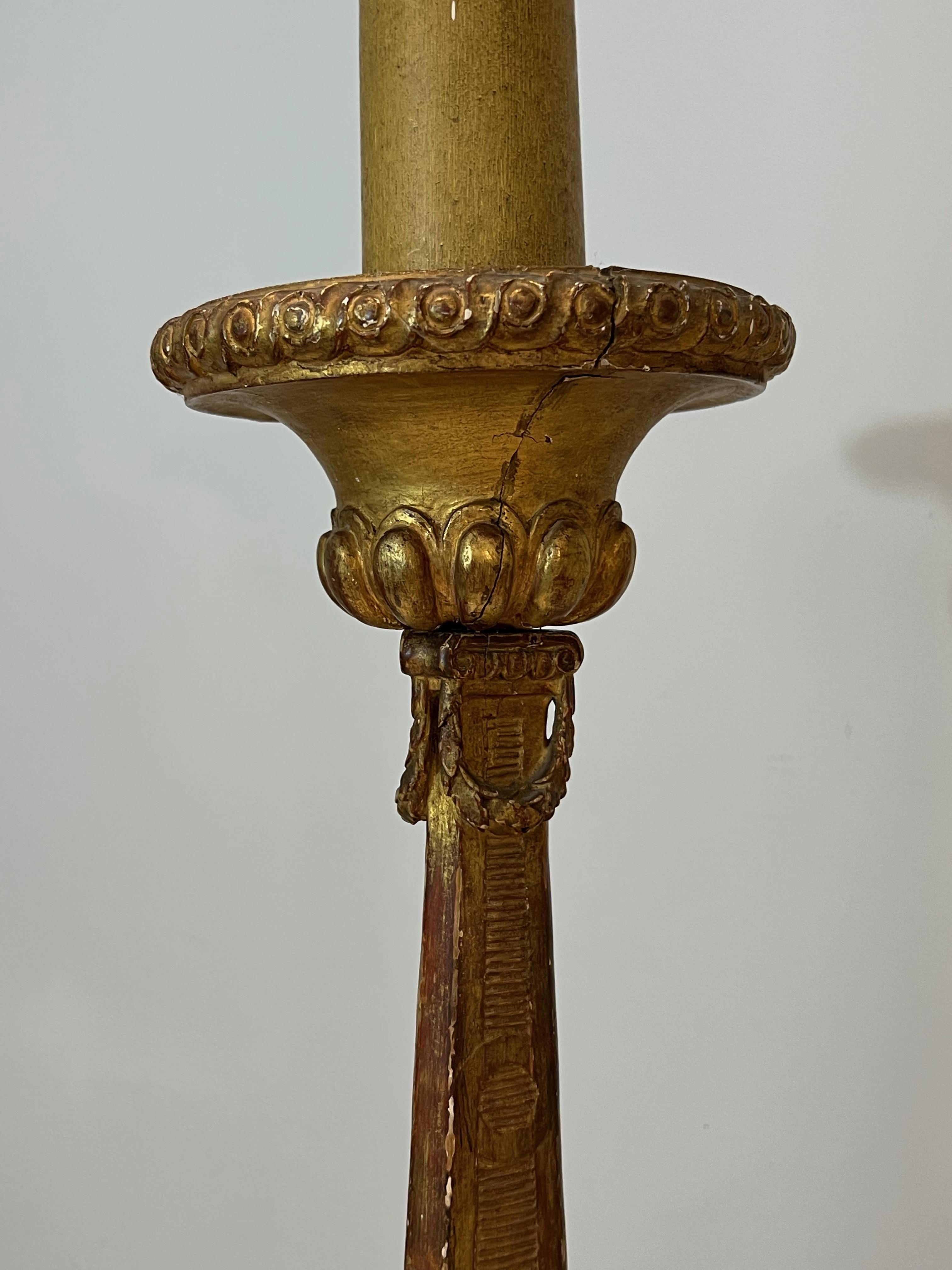 French Tall Gilded Carved Wood Candelabra on a Patinated Base For Sale