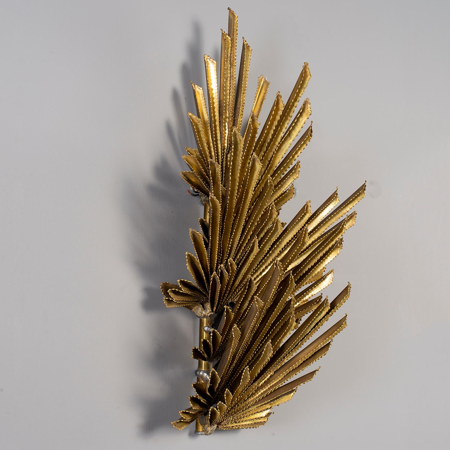 Wall sconce is leaf form gilt metal and attributed to Maison Jansen. There are four candelabra sized sockets and the wiring has been updated for US electrical standards. Very good vintage condition with minor scattered patina/wear to metal surface,