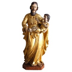 Tall gilt wood devotion of St Joseph and Child Jesus, late 17th century