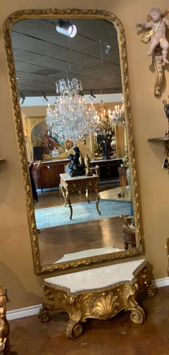 Tall giltwood framed pier mirror French 19 th c. With marble top console