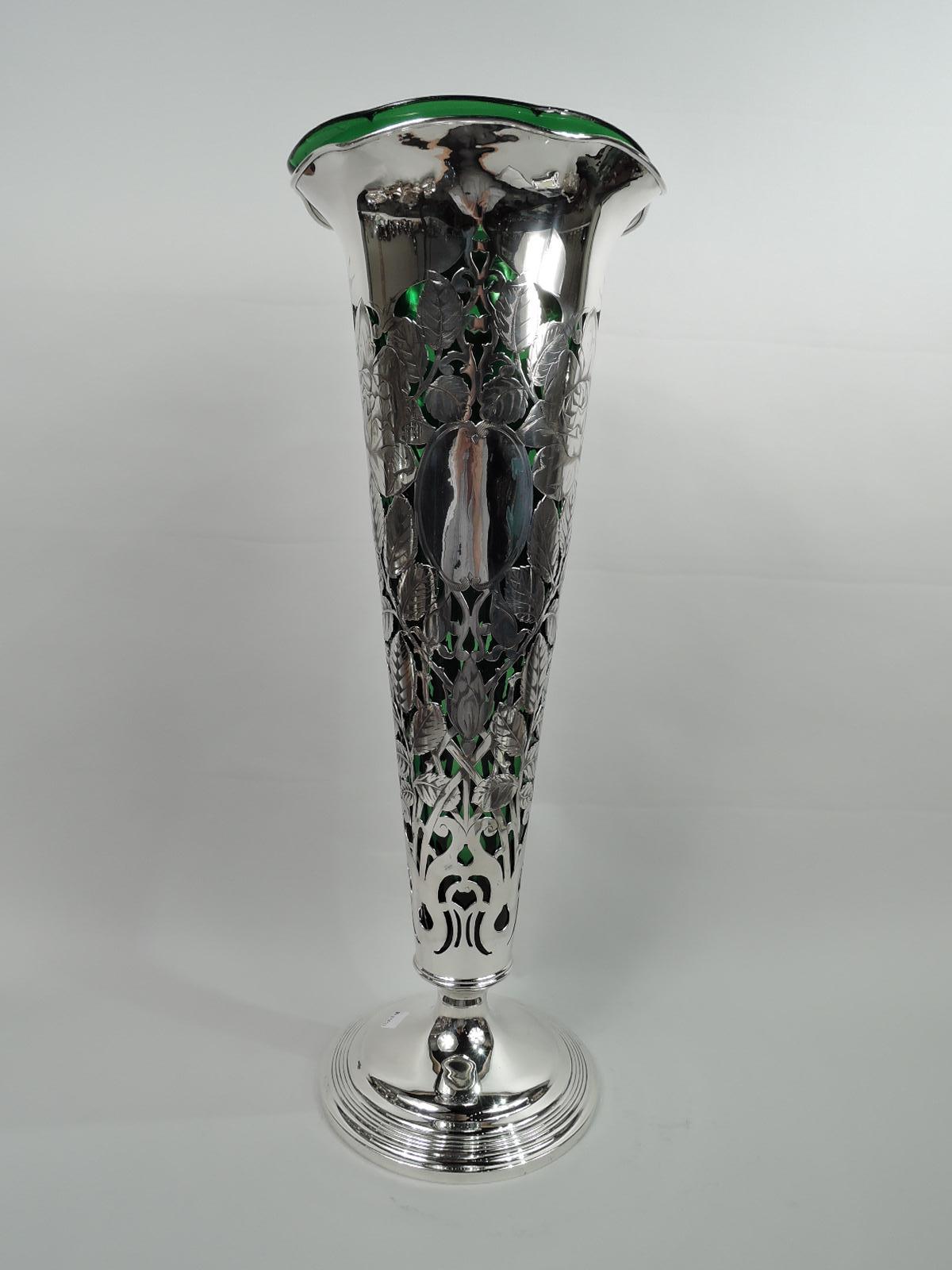 Tall Art Nouveau sterling silver trumpet vase. Made by Gorham in Providence in 1908. Conical with wavy rim and raised and reeded foot. Open floral ornament heightened with engraving in form of rosebuds and blooms on leafing stems. Plain and open