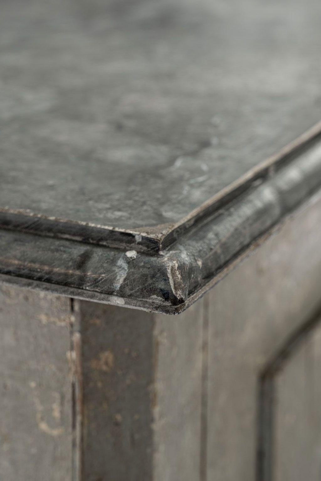 Tall gray-painted Swedish buffet, or cupboard, circa 1840-1869. Dark Gray faux marble painted top. Two paneled doors with lock and key. Sits inside hand-carved scalloped base. Three shelves. Nice large scale.