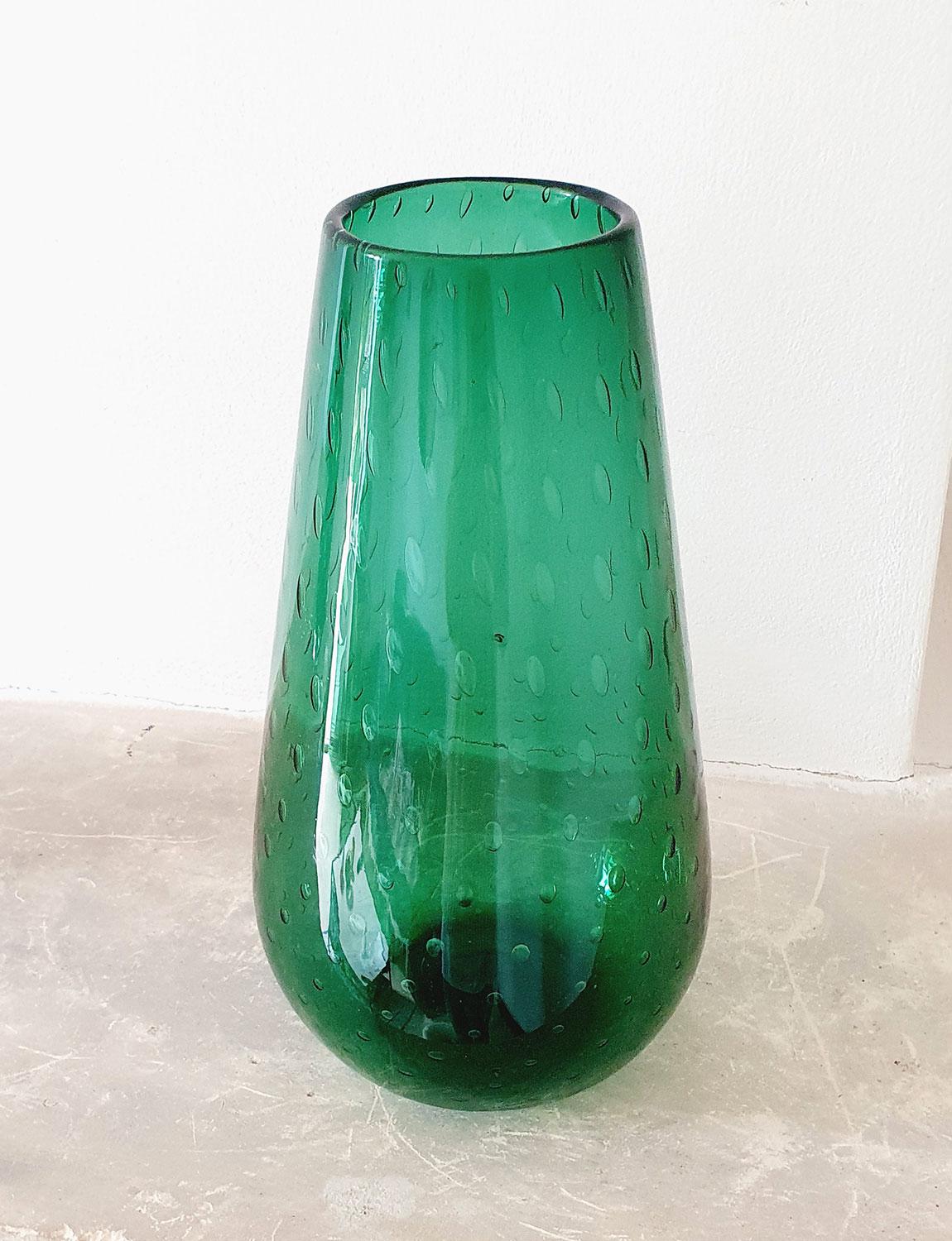 1970s Elegant Italian dark green hand blown vase with bolle (bubbles) throughout. There is the mark on the base where the molten glass has been cut from the blow pipe evidencing it's hand blown nature. In good condition and found here in Italy.