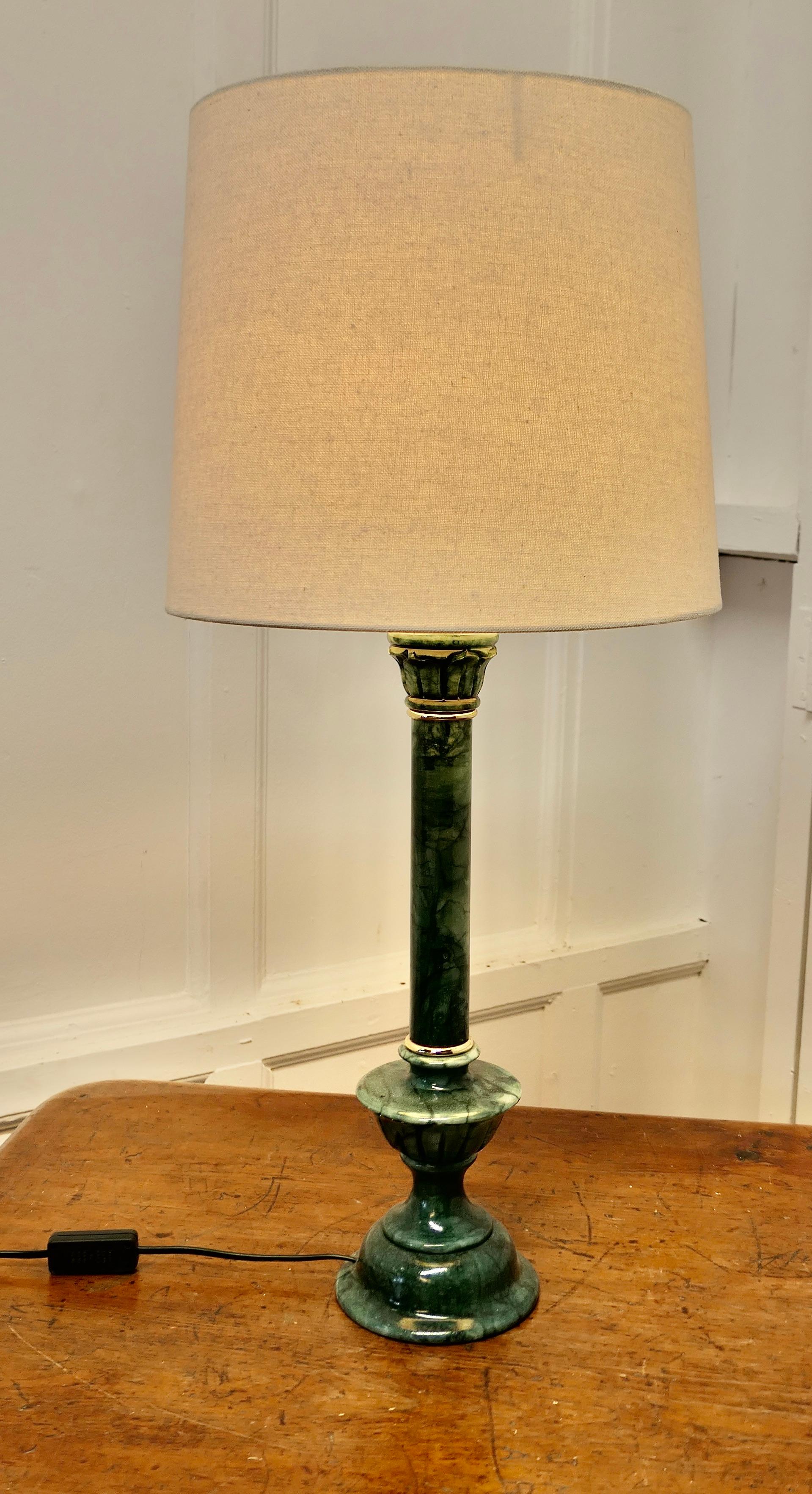 Tall Green Marble Table Lamp

This is a very heavy piece it is made in solid marble, the lamp has a shaped carved central column with Superb Marbling and gold trim
This is a very attractive piece it in good condition for its age and the wiring is