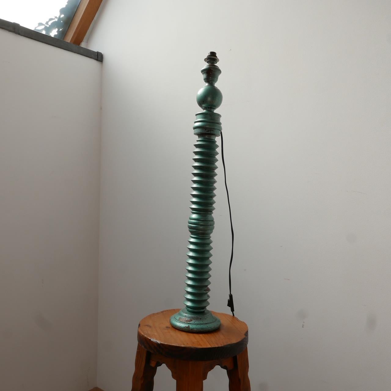 A turned wooden Art Deco table lamp. 

France, c1940s. 

Later painted at some point in a green. 

Re-wired and PAT tested. 

Evidence of historical worm, since treated as a precaution. There is wear to the paint and lamp commensurate with