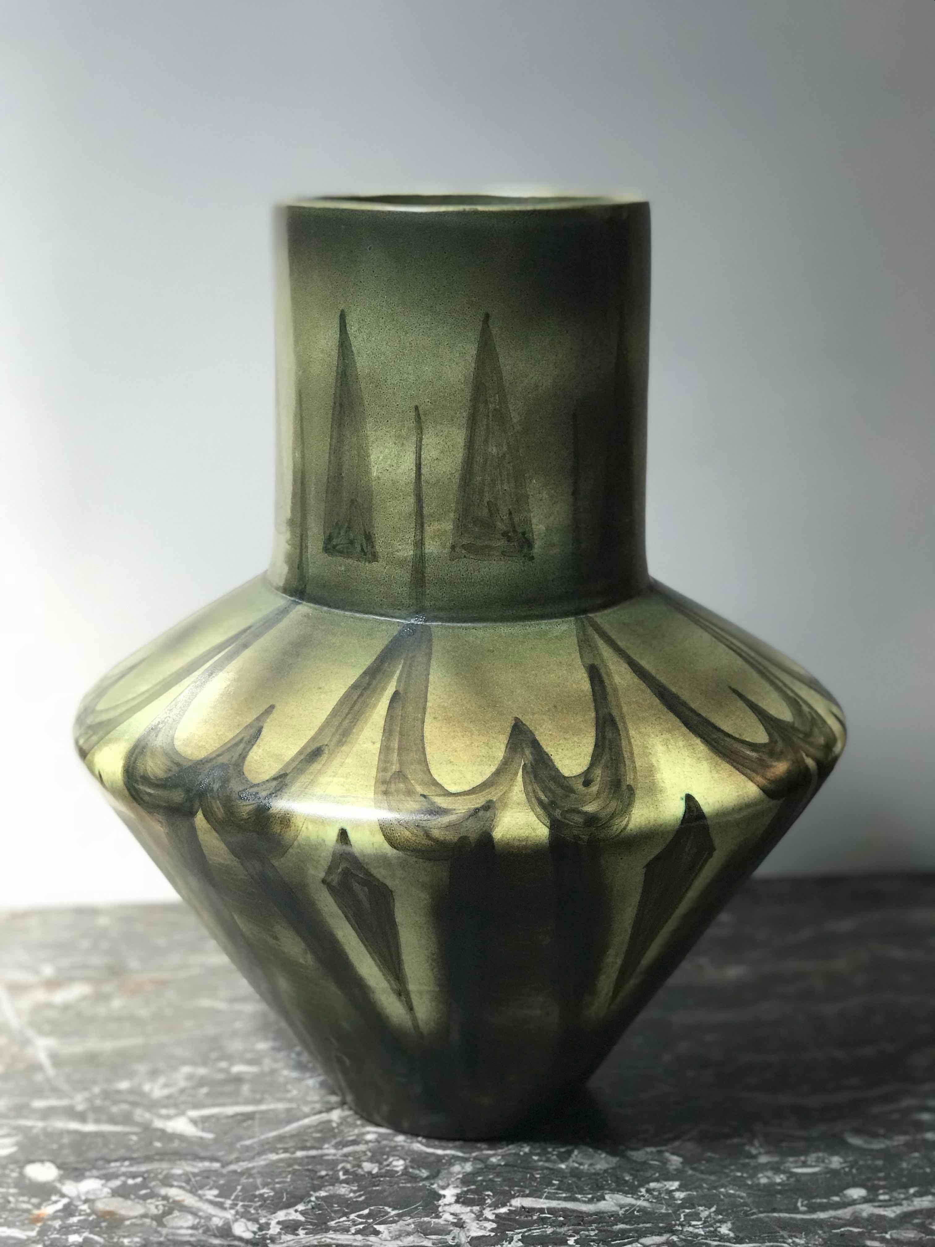 Tall green vase with abstract design from France circa 1940. 