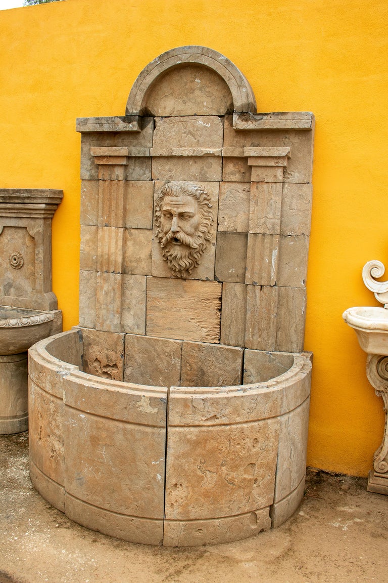 Tall Hand Carved Stone Wall Fountain with Aged Patina For Sale at 1stDibs