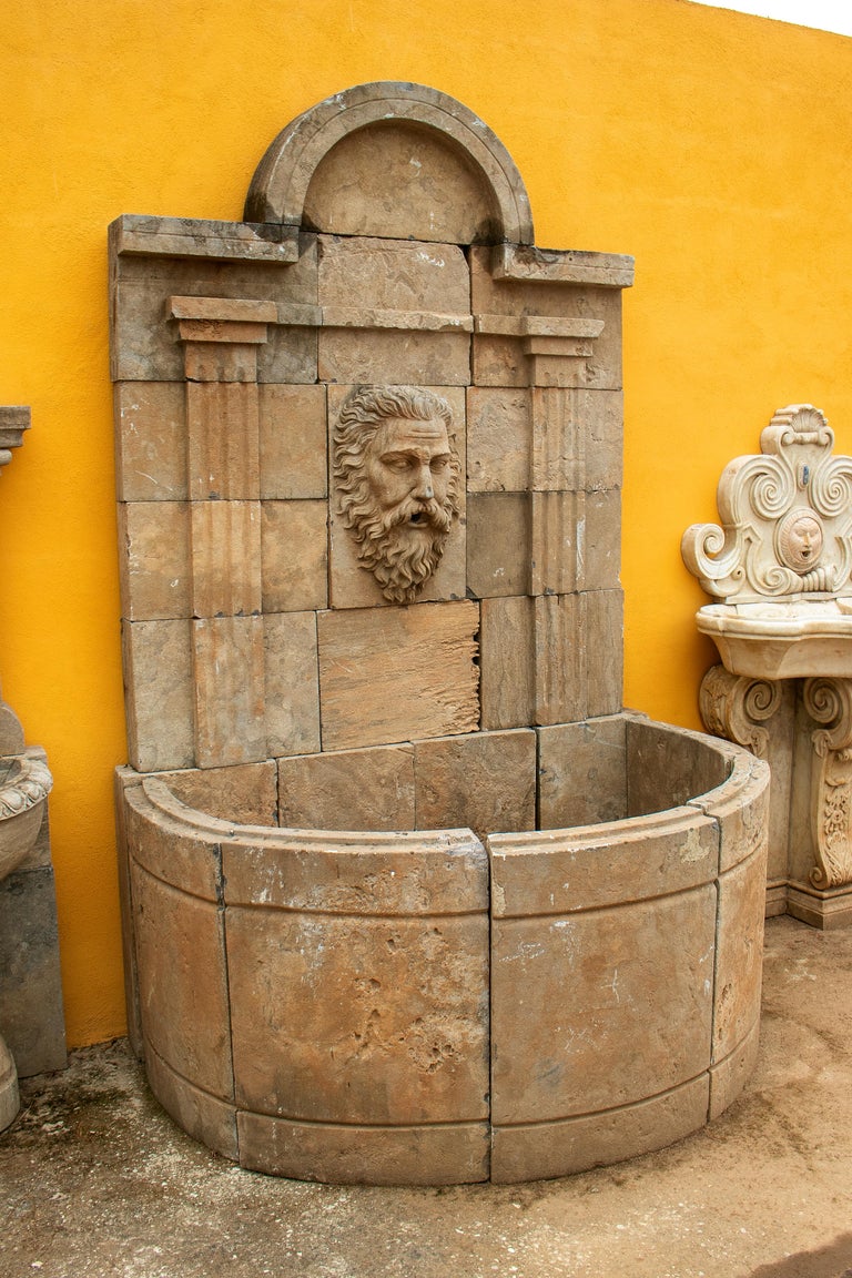Tall Hand Carved Stone Wall Fountain with Aged Patina at 1stDibs