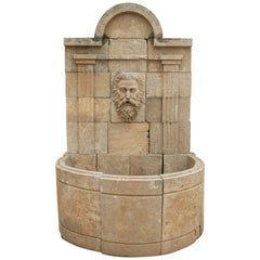 Tall Hand Carved Stone Wall Fountain with Aged Patina