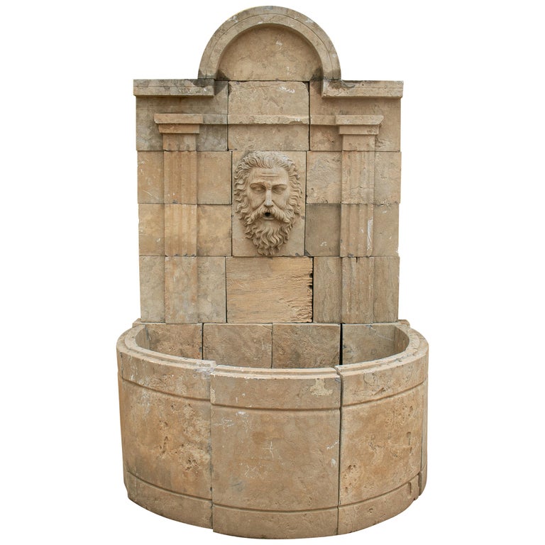Tall Hand Carved Stone Wall Fountain with Aged Patina at 1stDibs