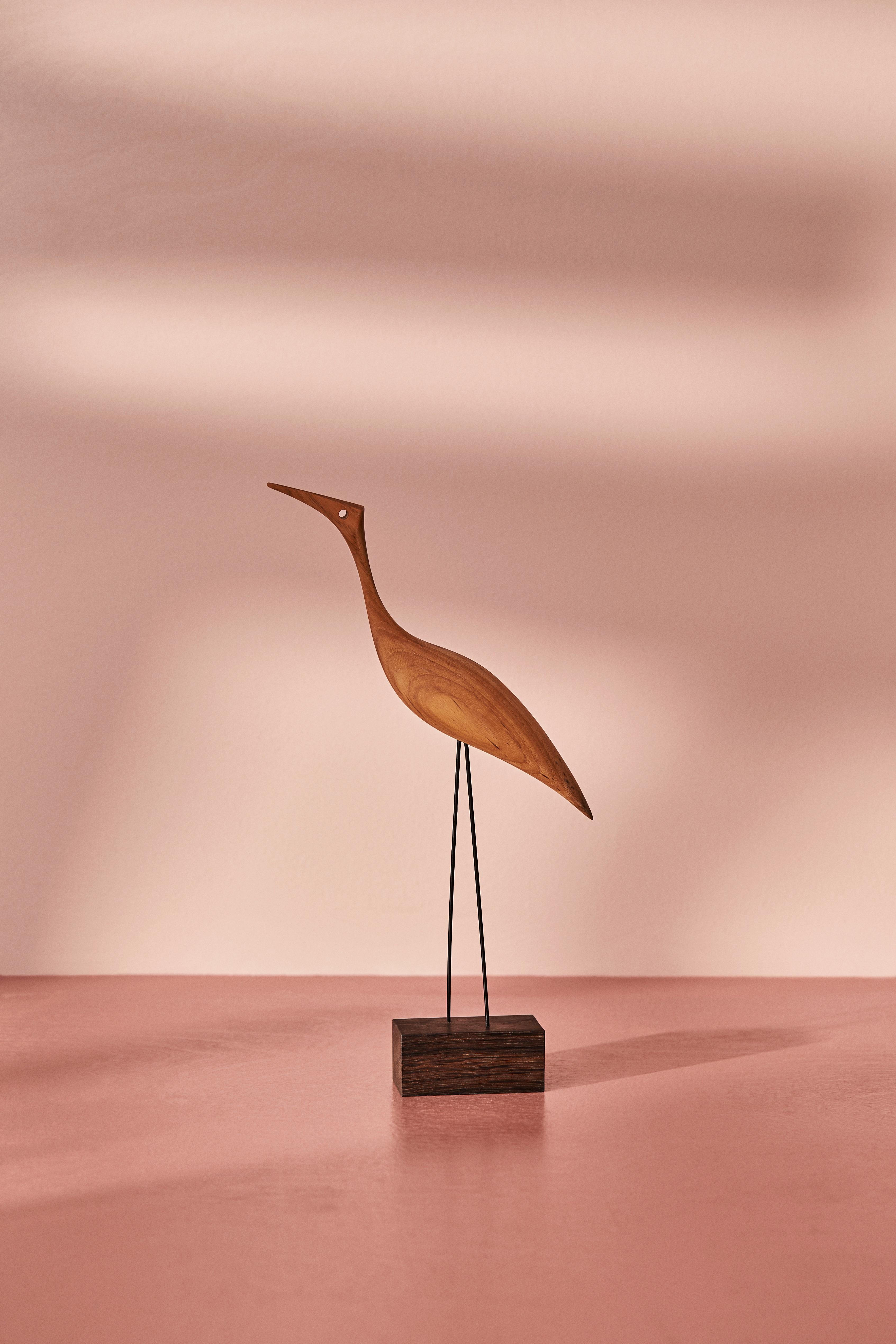 Charming teak birds with beaks and great personality. Manufactured in Denmark and designed by the internationally renowned designer, Svend Aage Holm-Sørensen, who was particularly famous for his lamp designs in the 1950s. Beak birds brings a smile