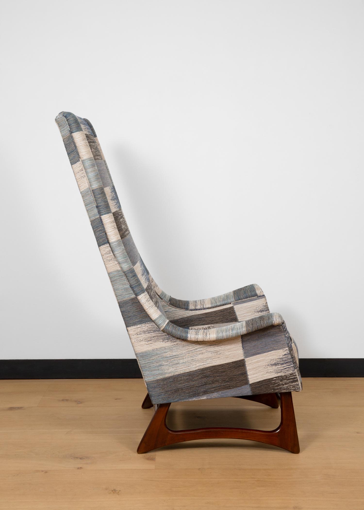 A very tall high back armchair designed by Adrian Pearsall for Craft Associates.
The sculptural sled style base is made from solid walnut and the chair features new upholstery 'Ikat Weave' designed by acclaimed British Interior Designer Kit Kemp,